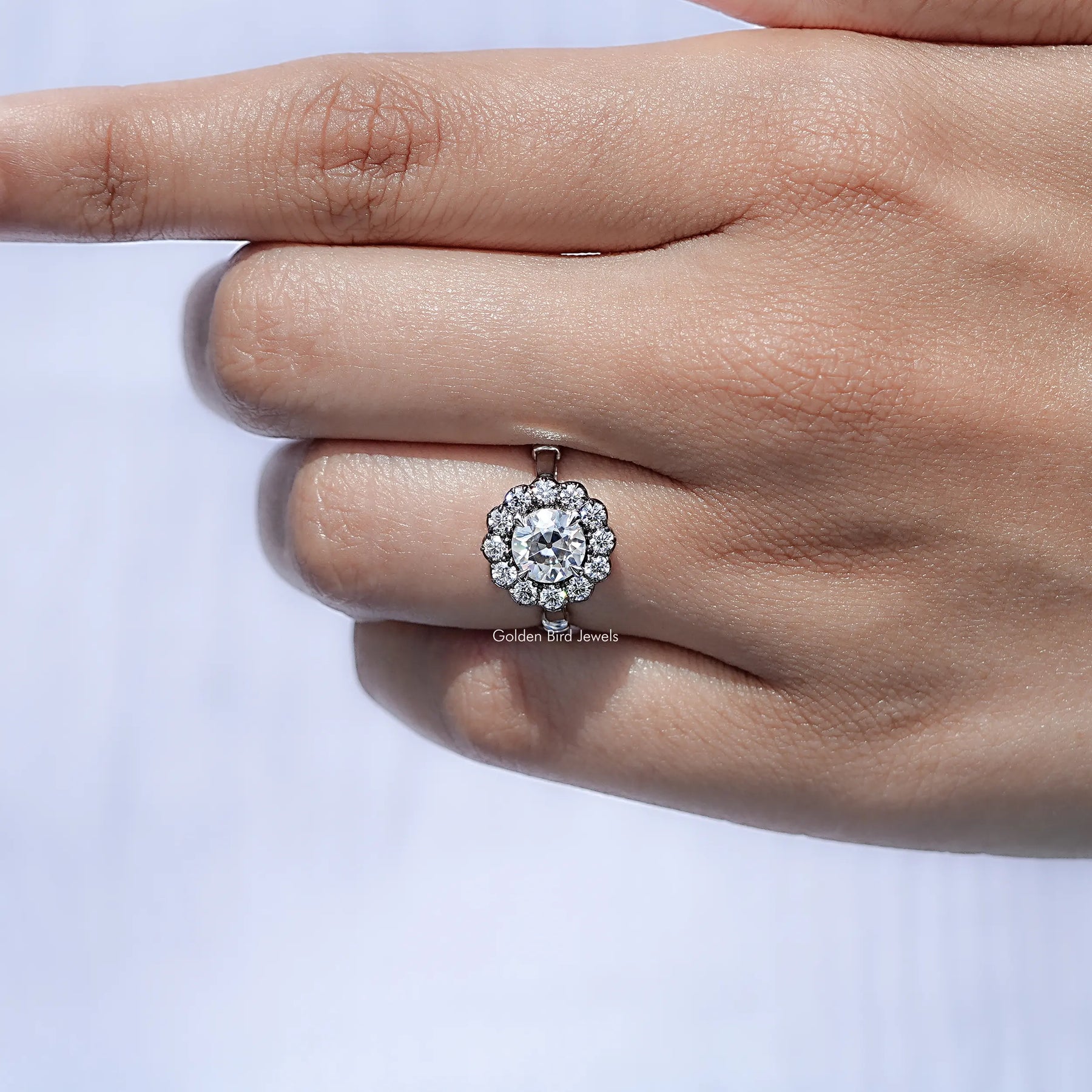 In finger front view of Halo Moissanite Engagement Ring