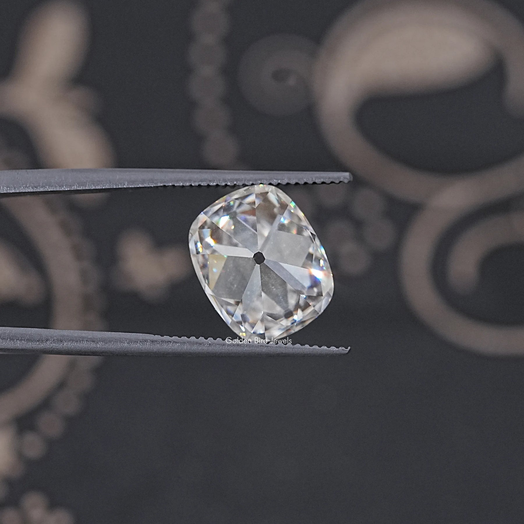 In Tweezer View Of Old Mine Cushion Cut Loose Moissanite Stone