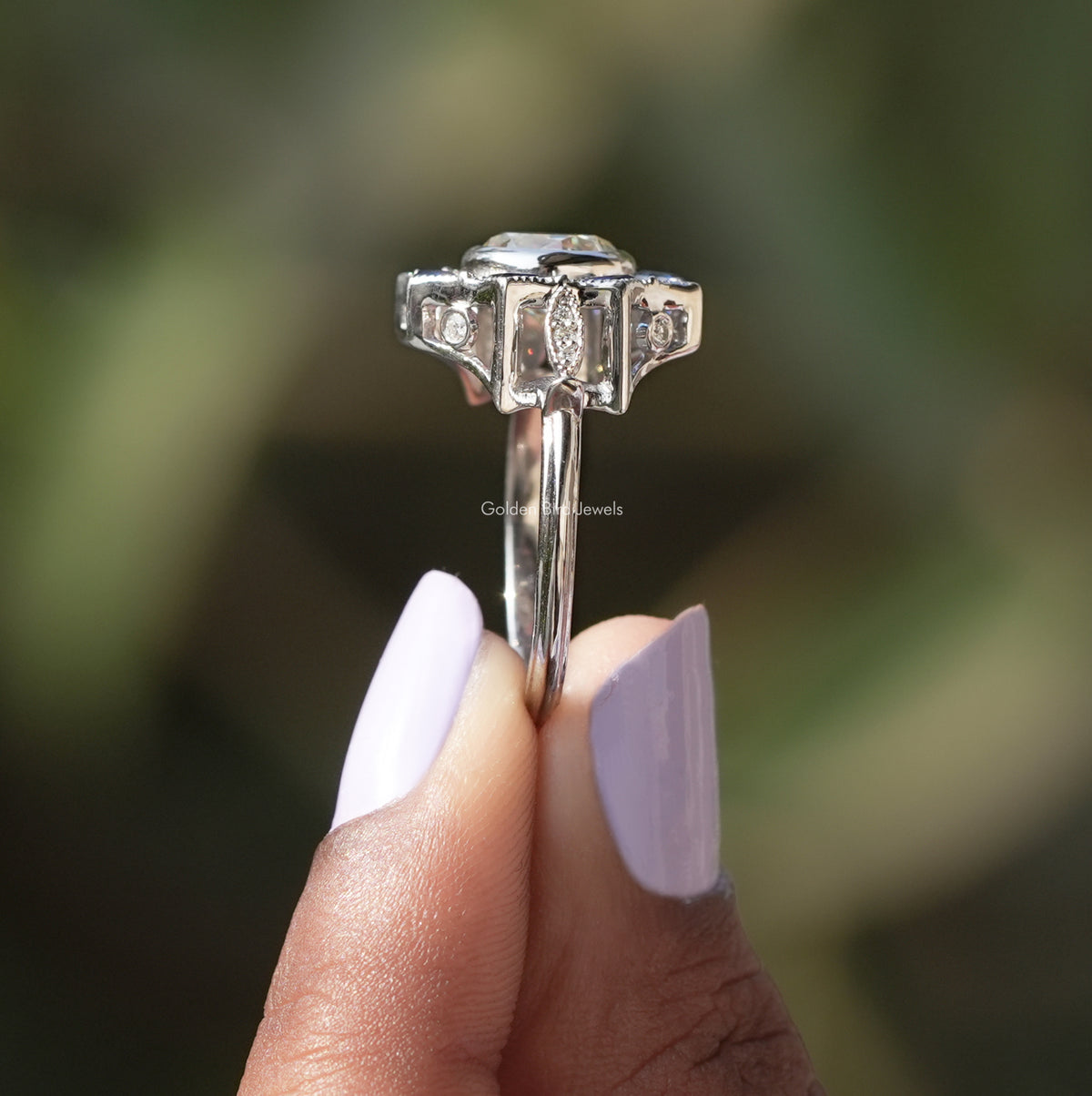 Side View of Old European Round Cut Moissanite Ring In two fingers