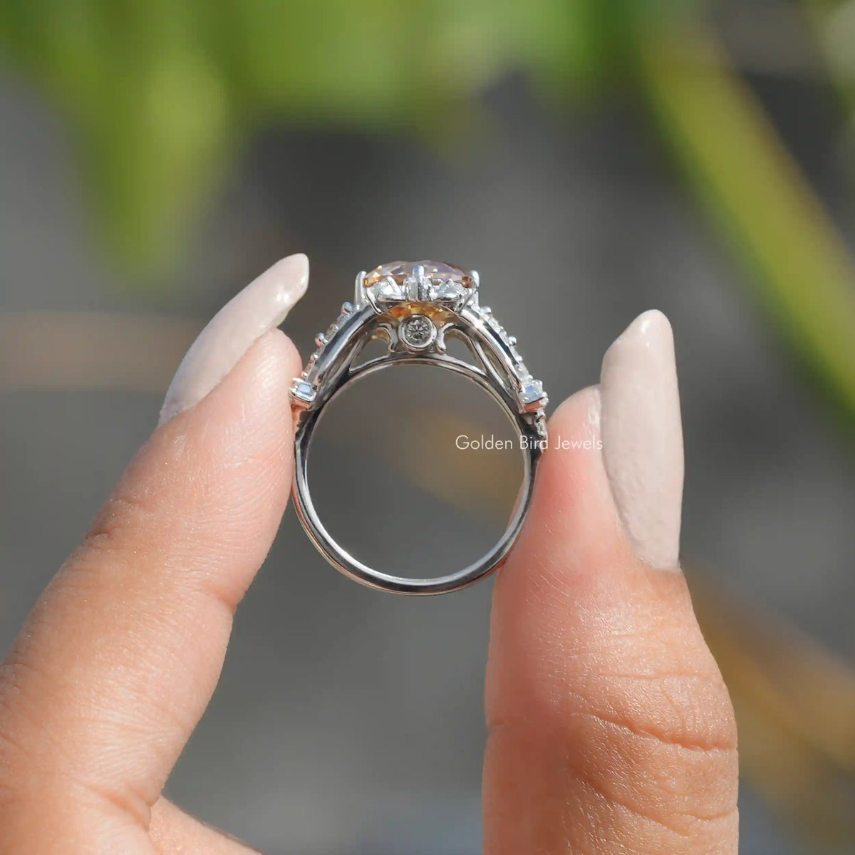 Back View of Old European Round Cut Moissanite Ring In two fingers