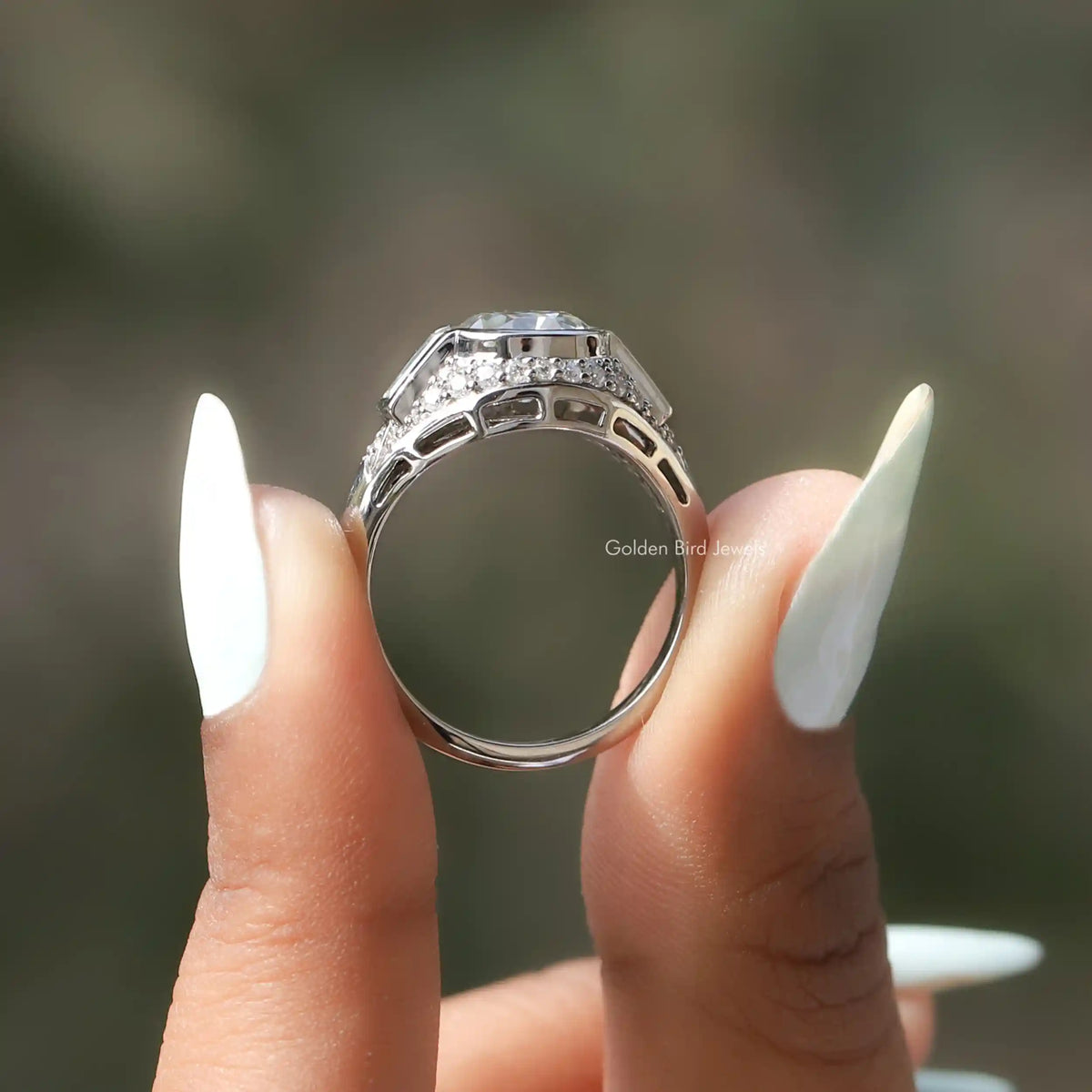 Back View of Round Cut Moissanite Vintage Ring In two fingers