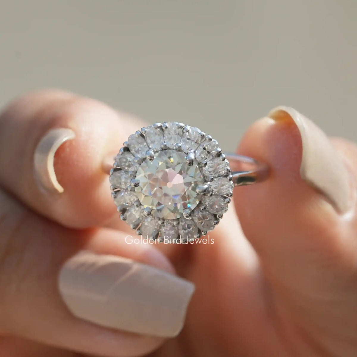 Front View of Old European Round Cut Moissanite Ring In Two Fingers