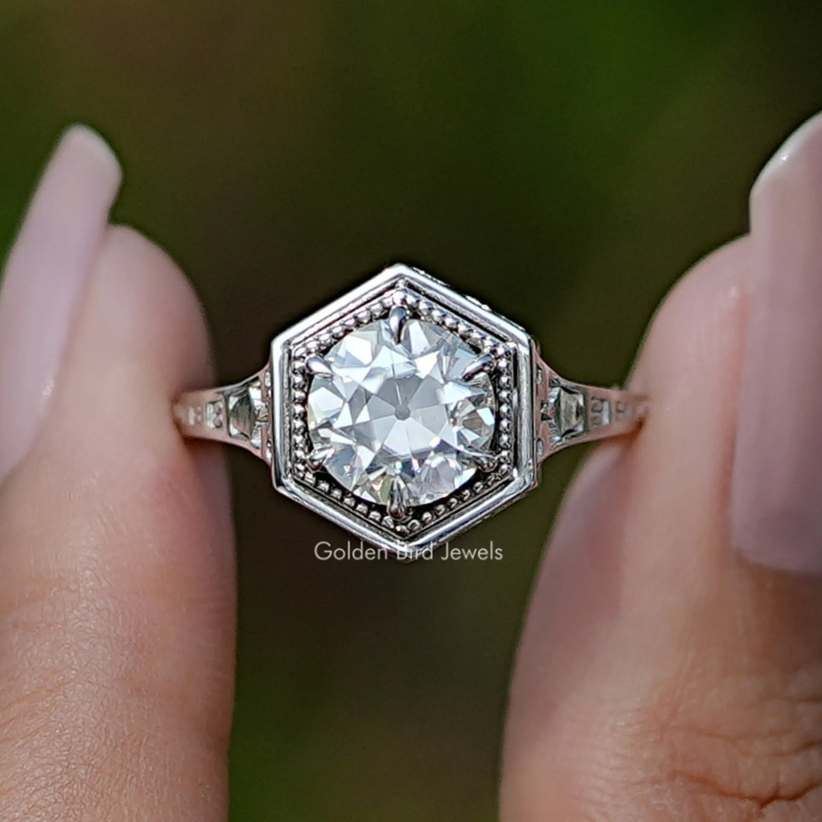 Front View of Old European Round Cut Moissanite Ring In two Fingers