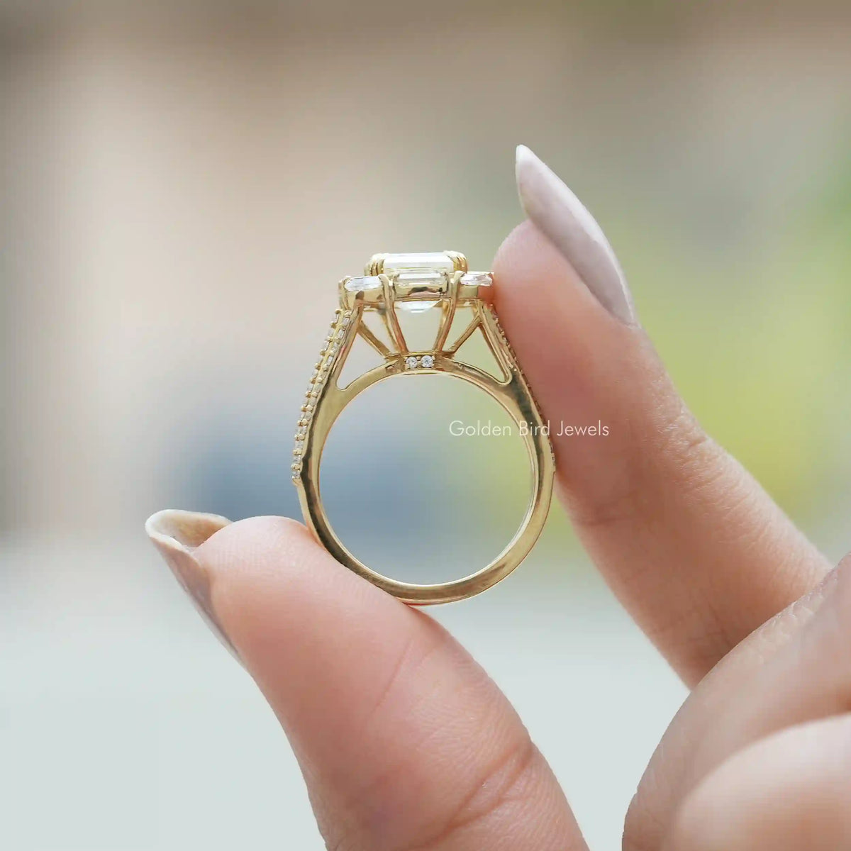 Back View of Asscher Cut Moissanite Engagement Ring In two fingers