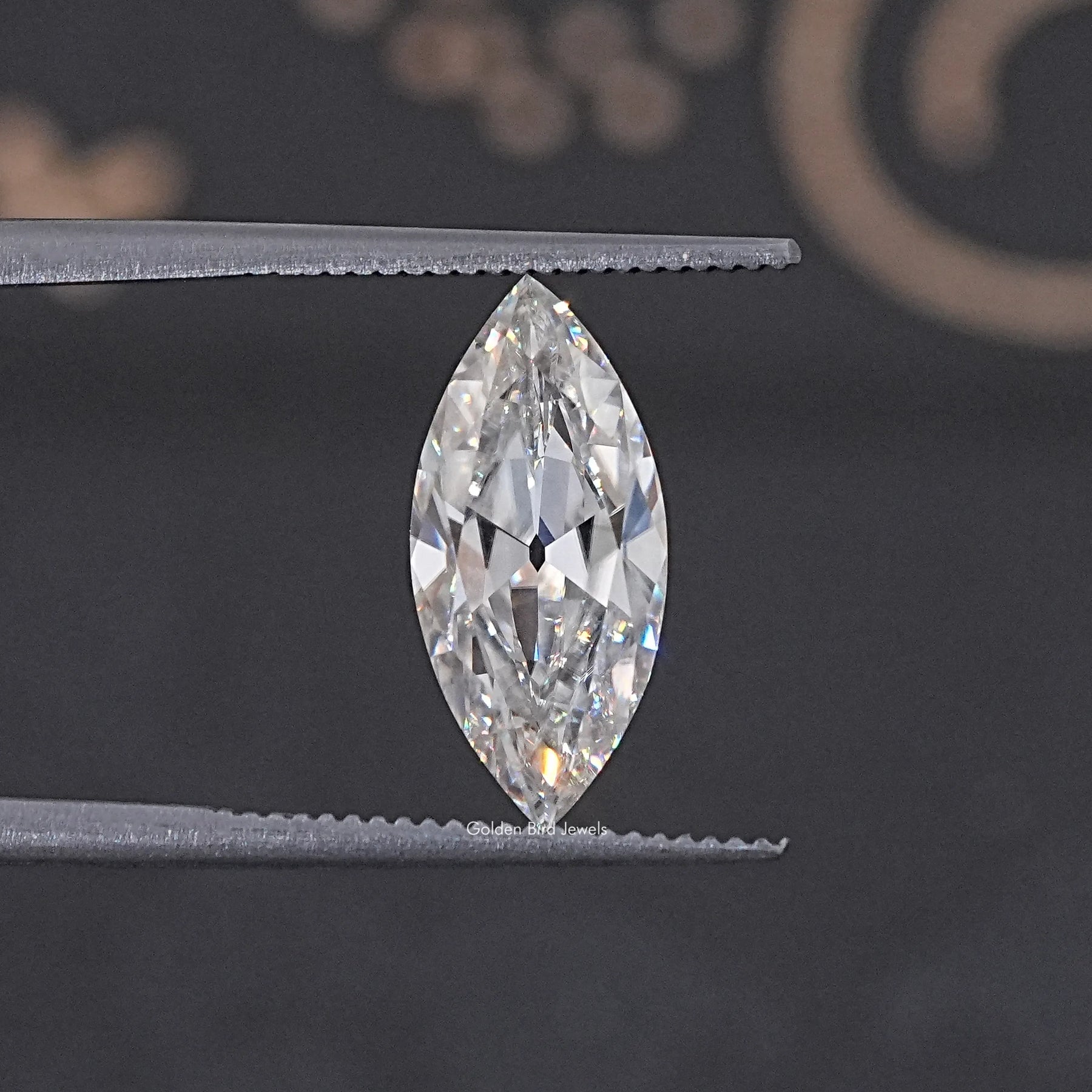 In Tweezer View Of Old Mine Marquise Cut Loose Moissanite Stone