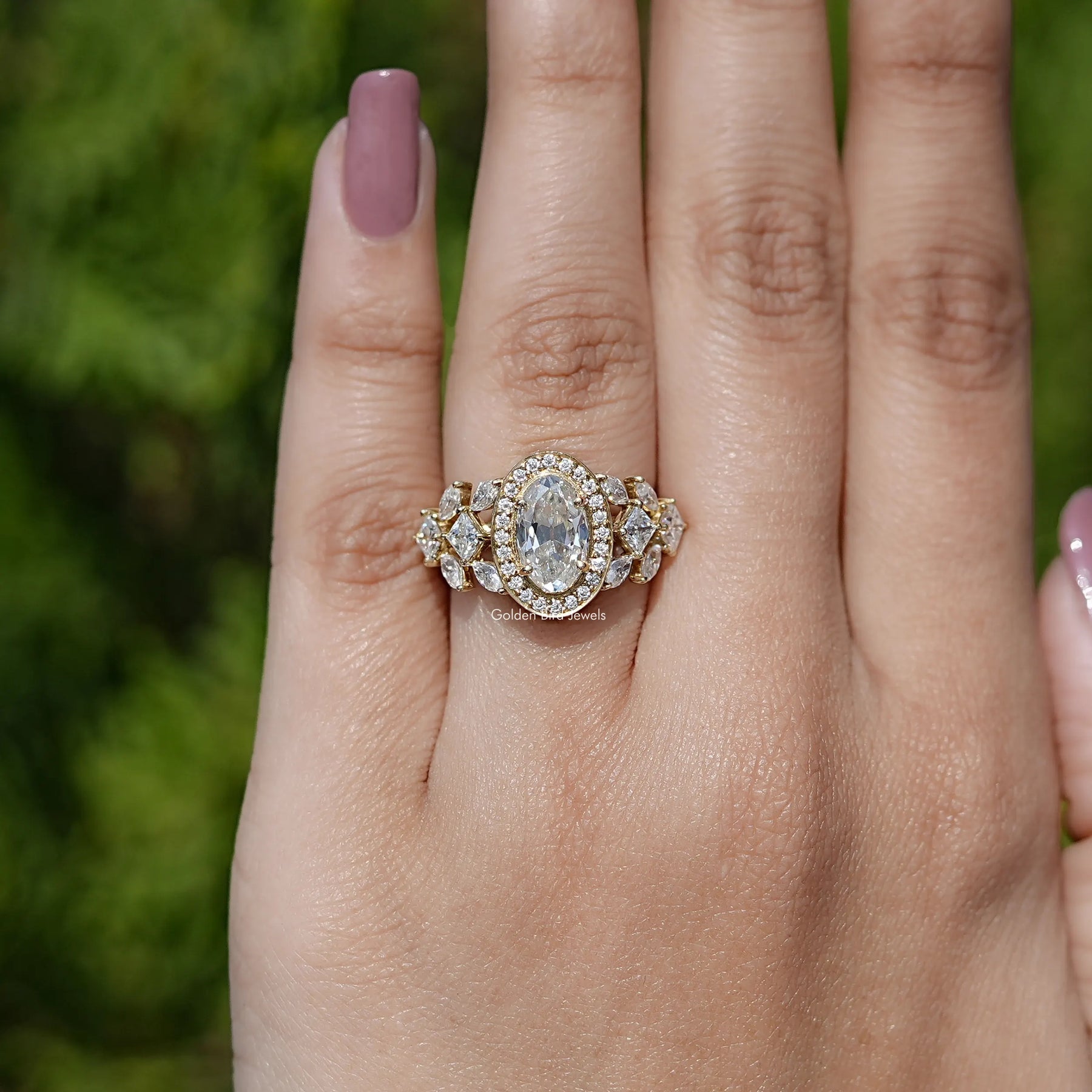 Detailed View of Moval Cut Moissanite Cluster Engagement Ring In Yellow Gold