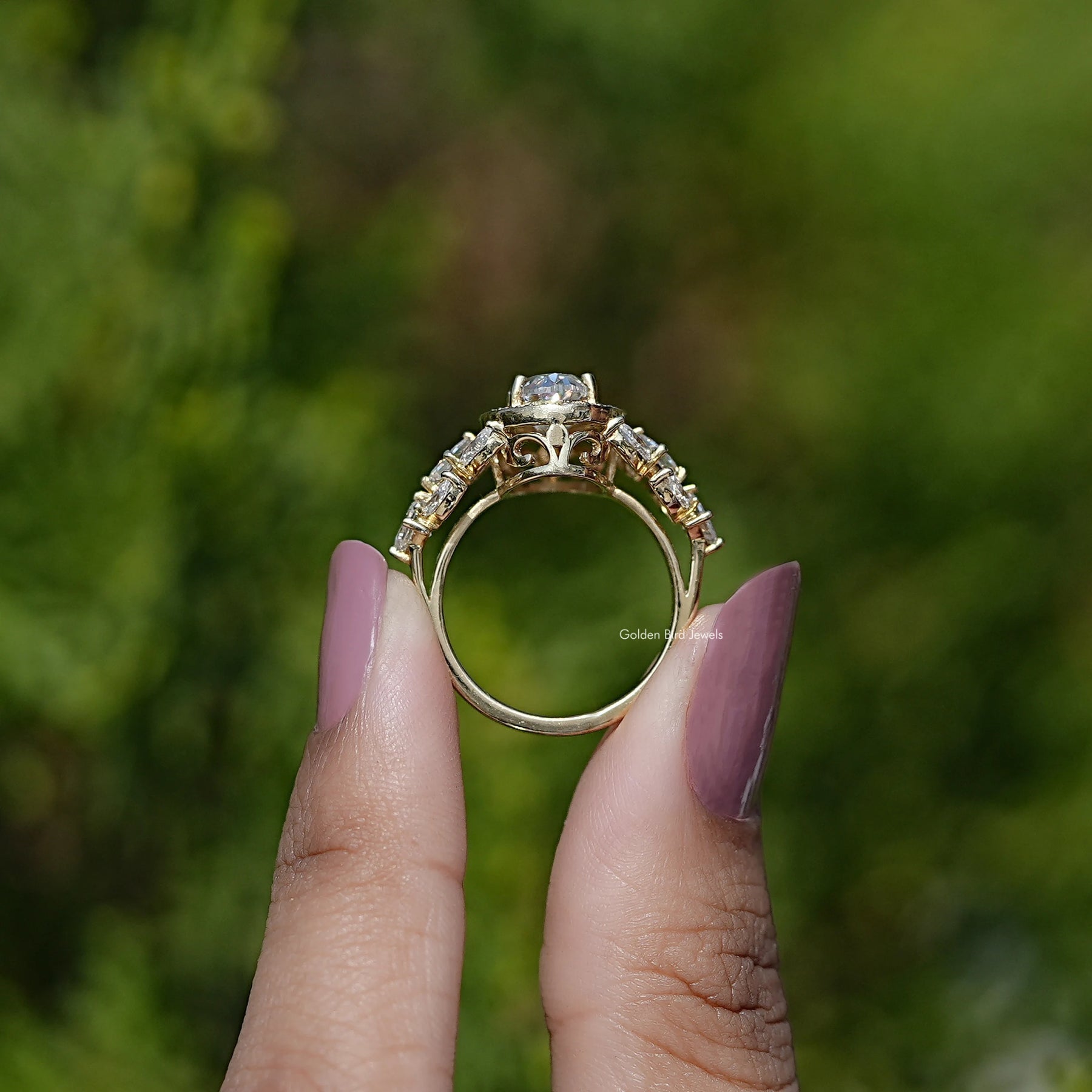 Back View of Old Mine Moval Cut Moissanite Halo Cluster Ring In two fingers
