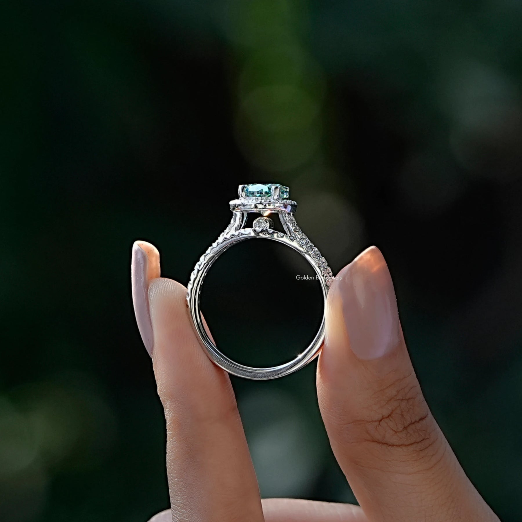 Back View A Oval And Round Cut Bridal Ring Set in two fingers