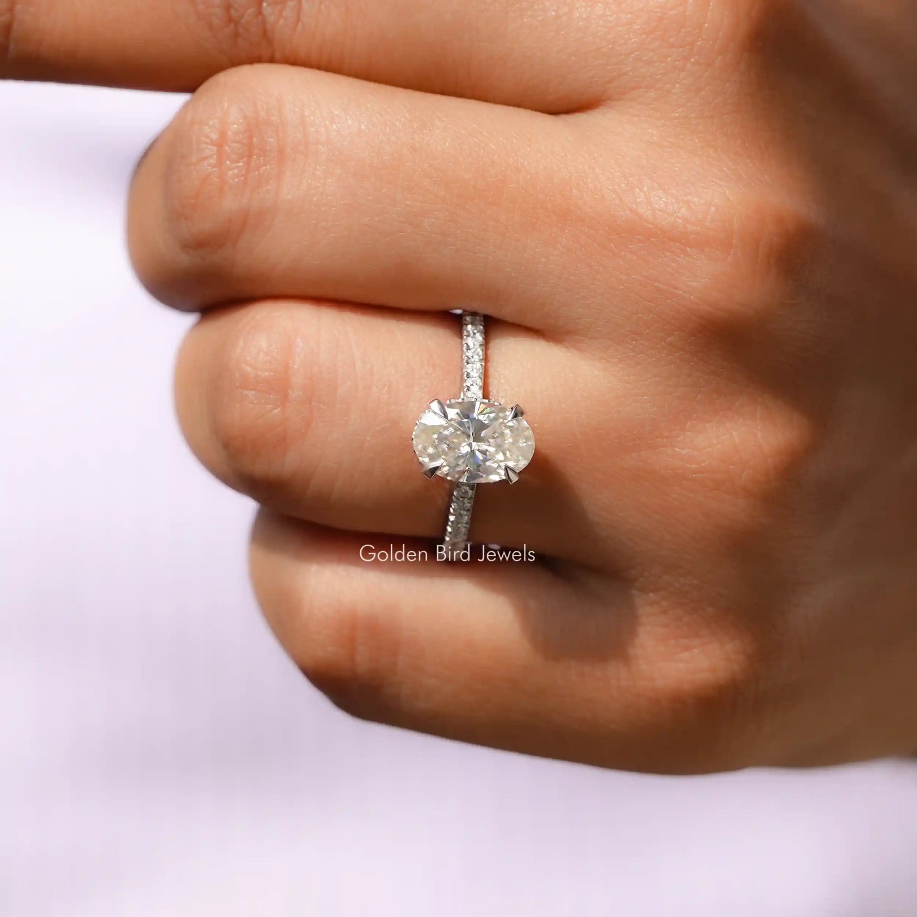 View of Oval Cut Moissanite Accent Stone Ring In finger