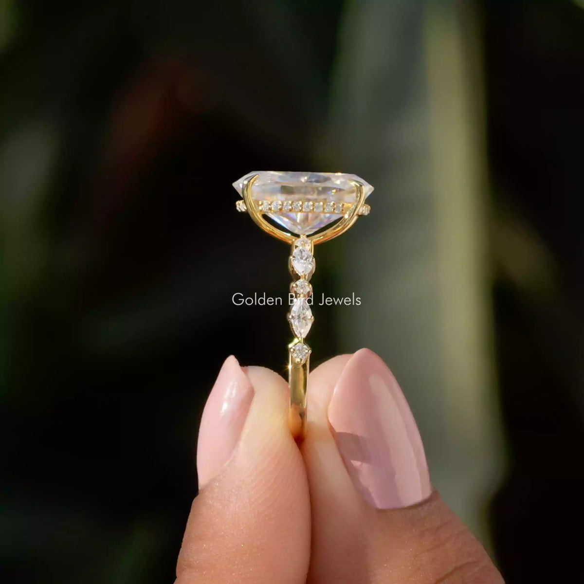 Side View of Crushed Ice Oval Cut Eternity Ring In two fingers