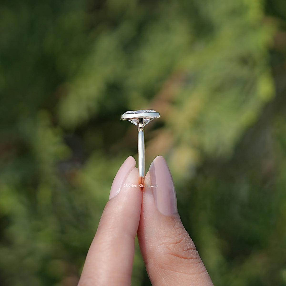 Side View of Bezel Set Oval Moissanite Engagement Ring