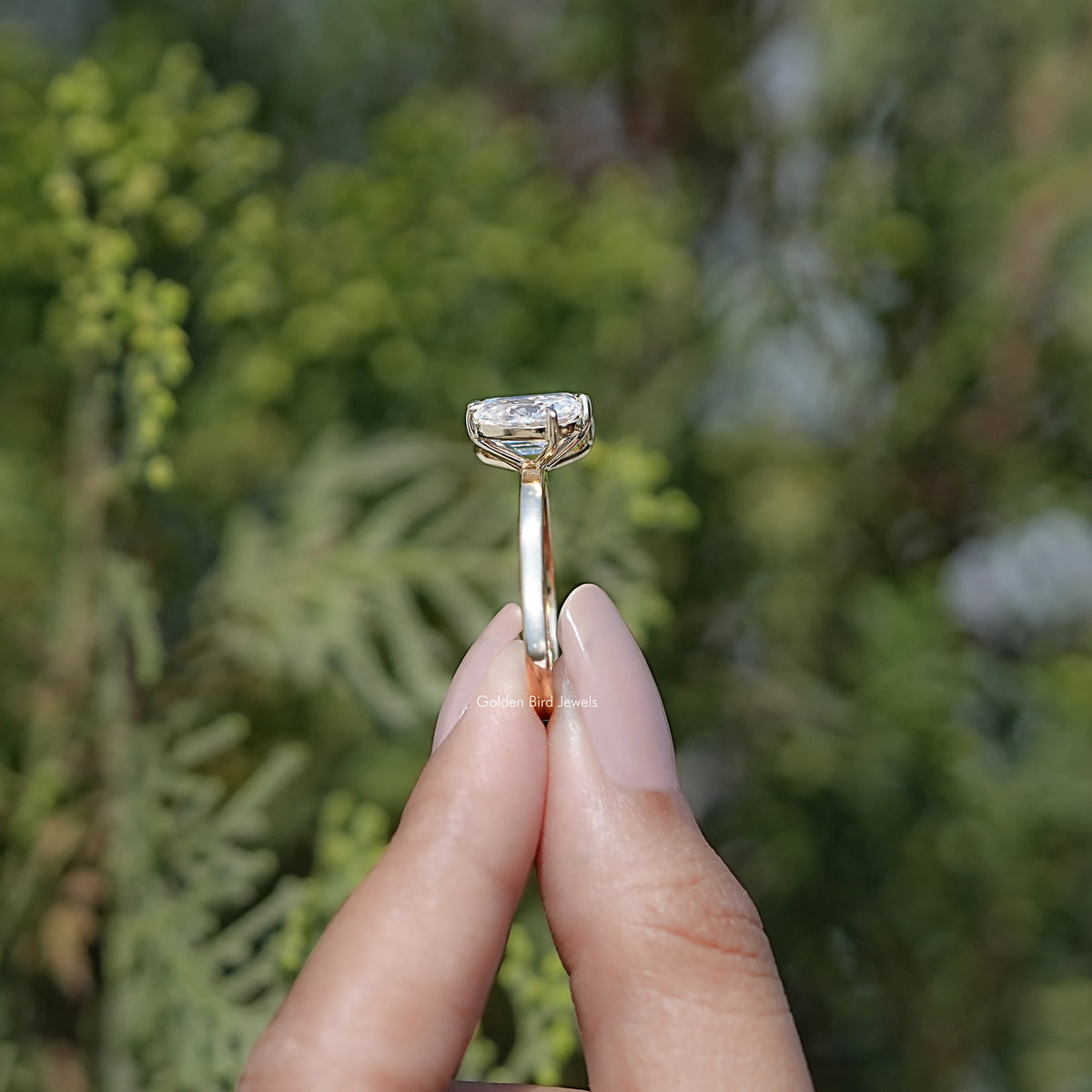 Side View of Pear And Emerald Cut Moissanite Two Stone Ring