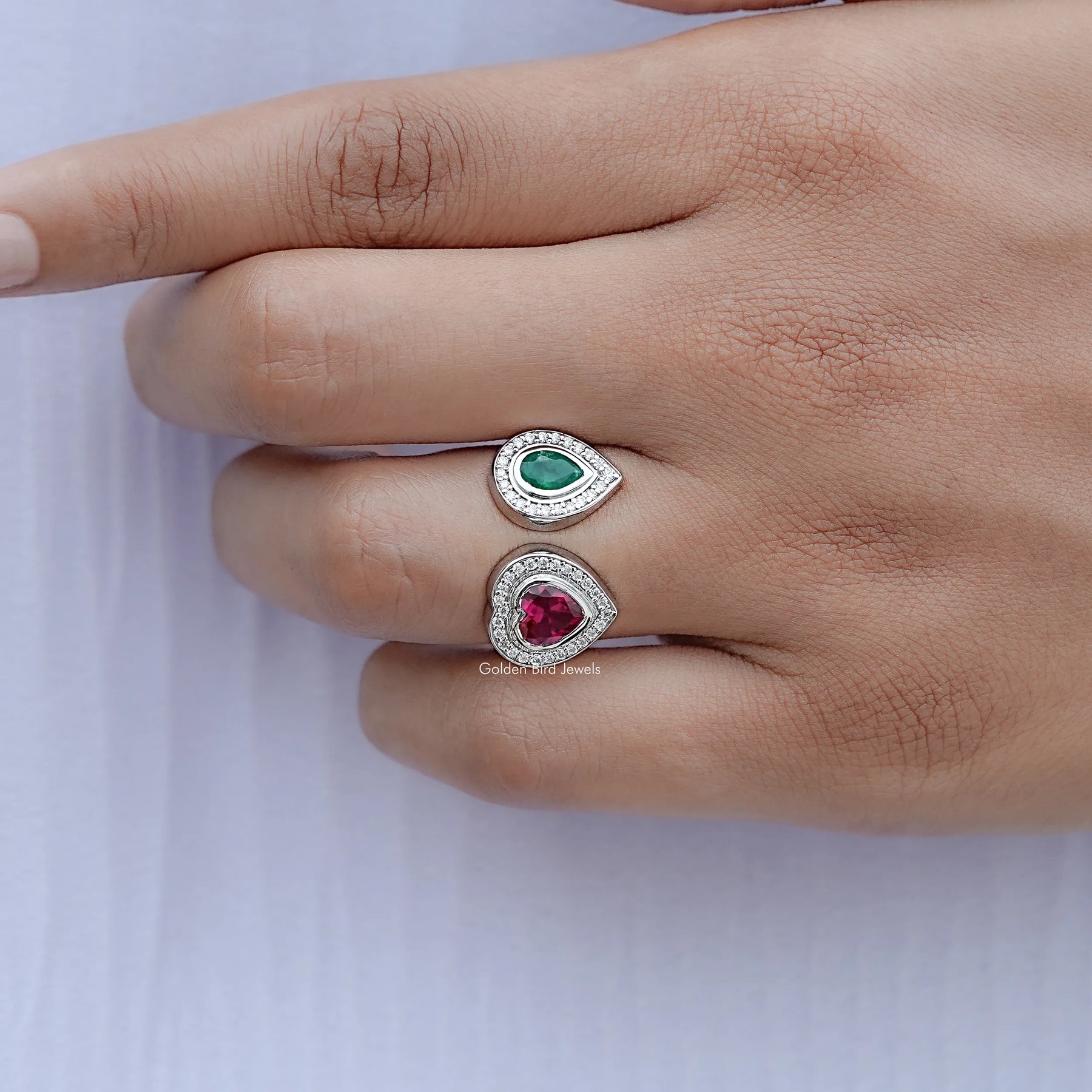 View of Pear And Heart Cut Moissanite Ring in prongs setting