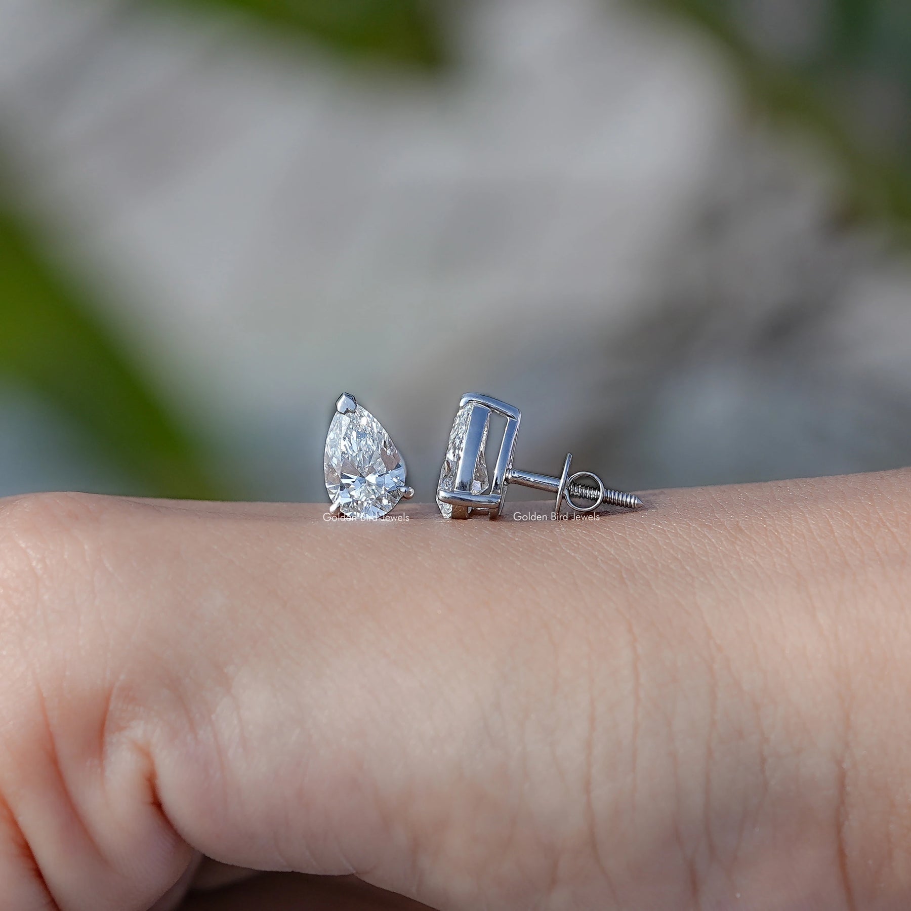 Front And Back Side View Of pear Cut diamond Stud Earrings