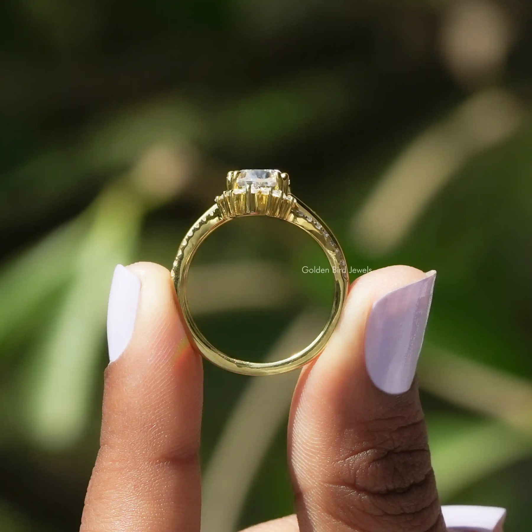 Back View of Moissanite Pear Shaped Bridal Ring Set In two fingers