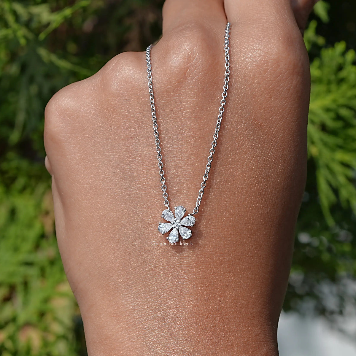 In Hand Holding the Pear Shaped Lab Diamond Flower Pendant