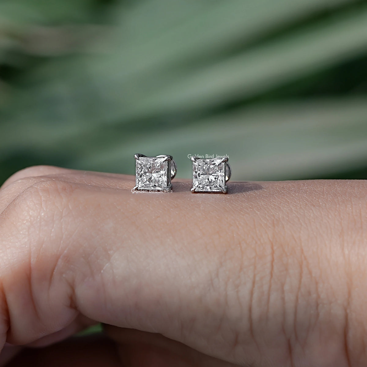 In Hand View Of princess cut diamond Stud Earring