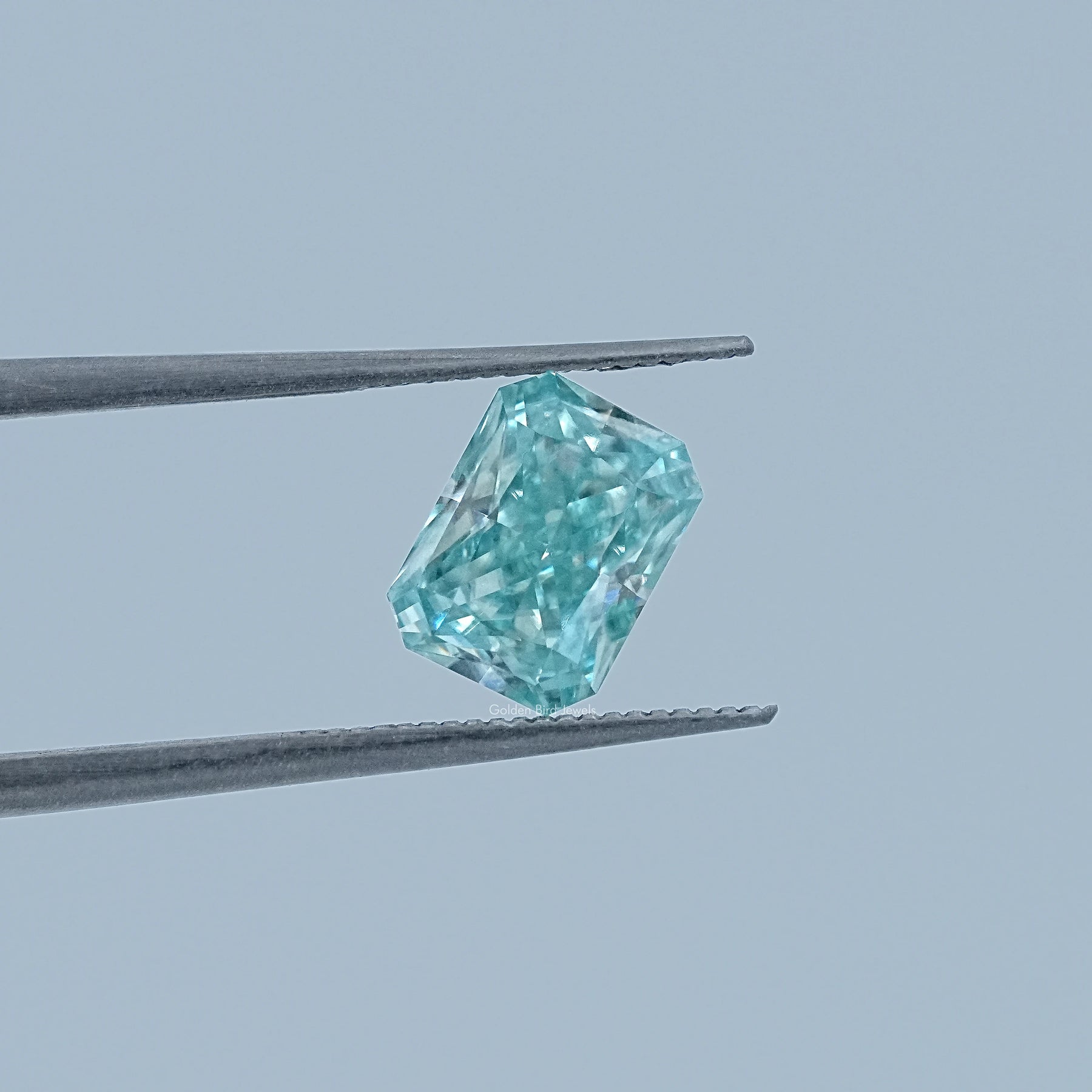 In Tweezer View Of Radiant Cut Loose Moissanite