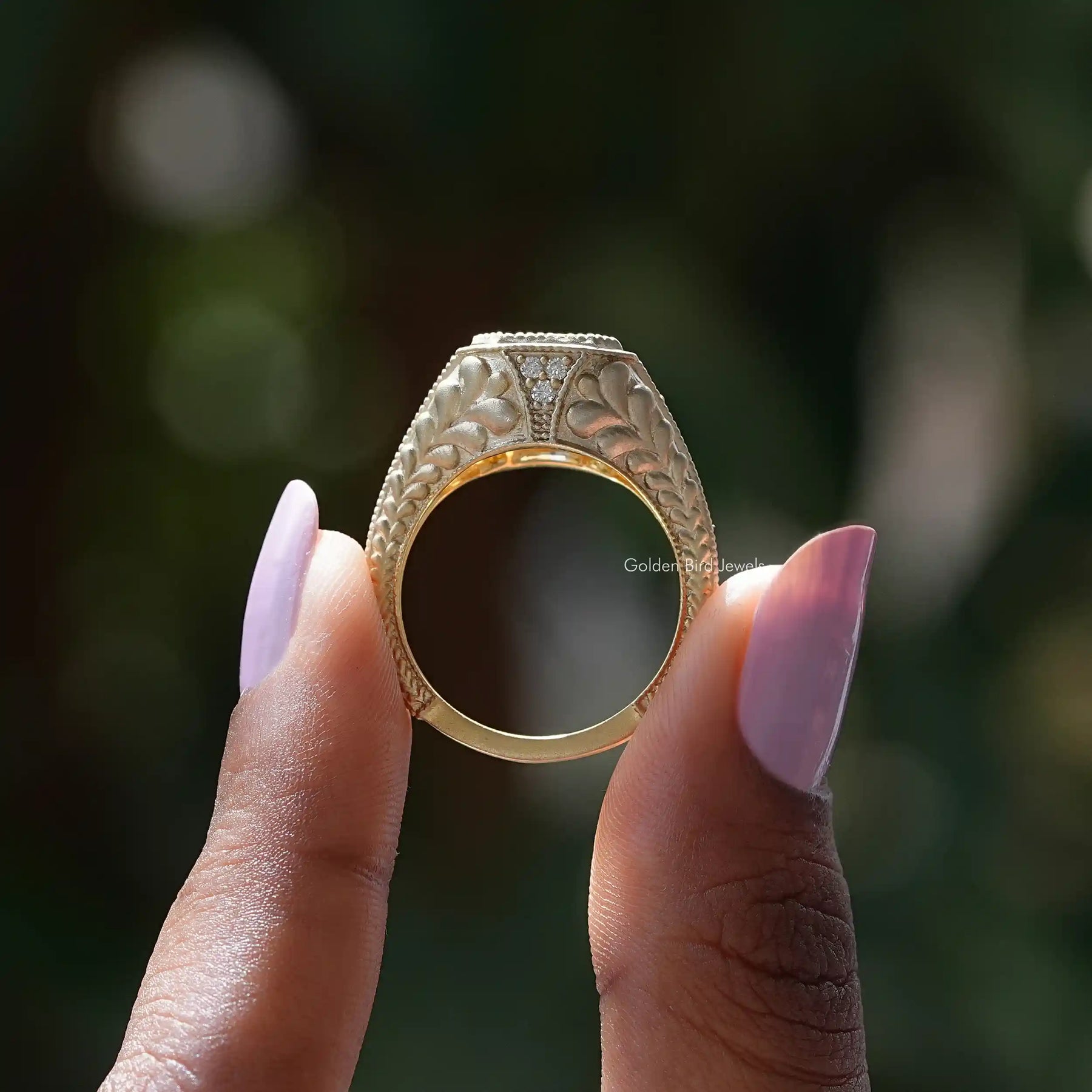 Back View of Radiant Cut Moissanite Acent Ring In two fingers