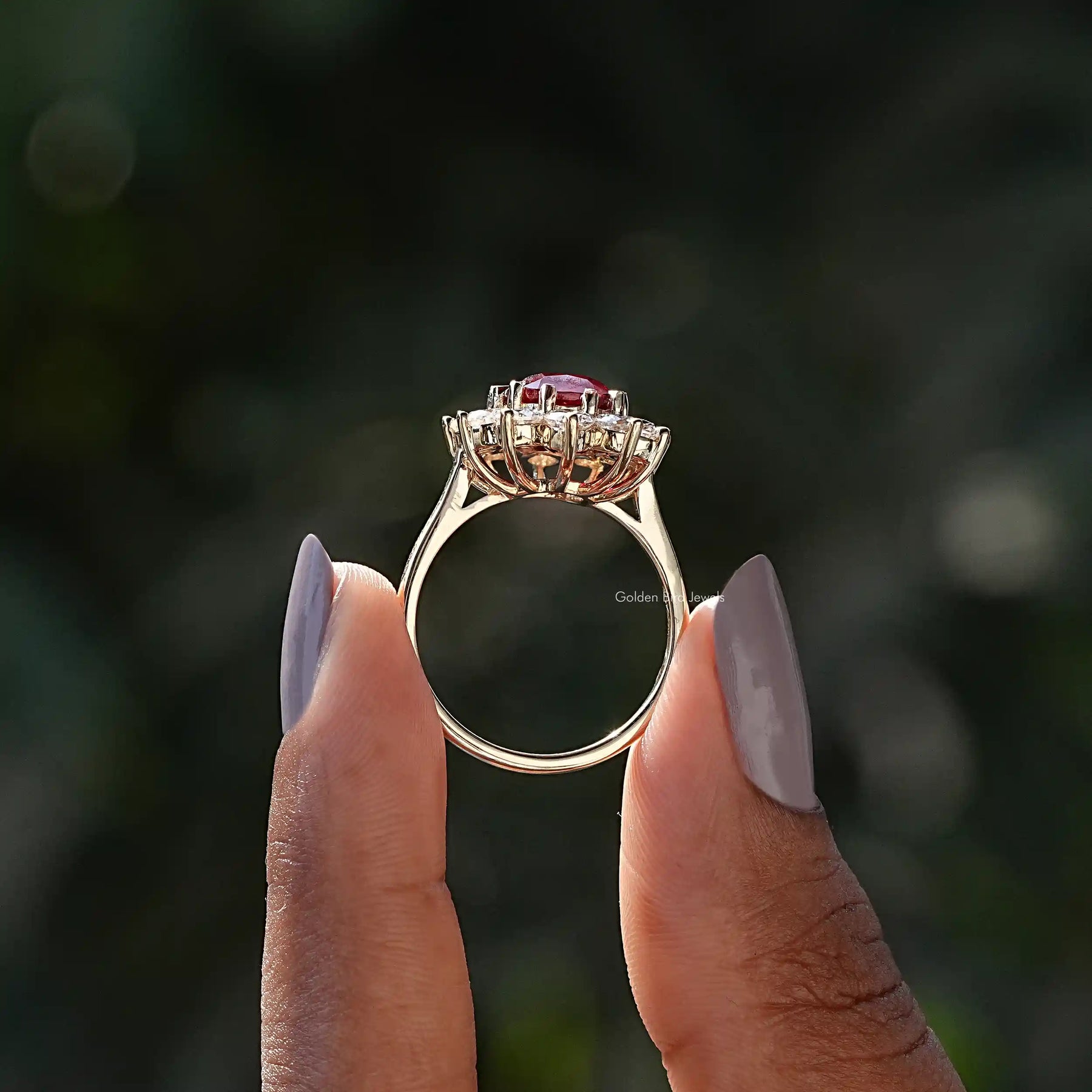 Back View of Cushion Cut Halo Engagement Ring In two fingers
