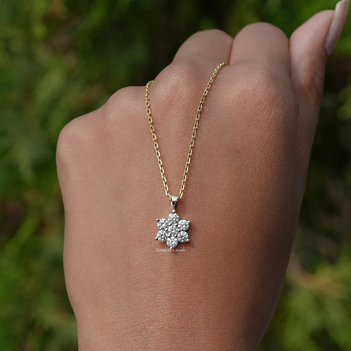 In hand Back View of Holding in the Round Cut Lab Diamond Floral Pendant