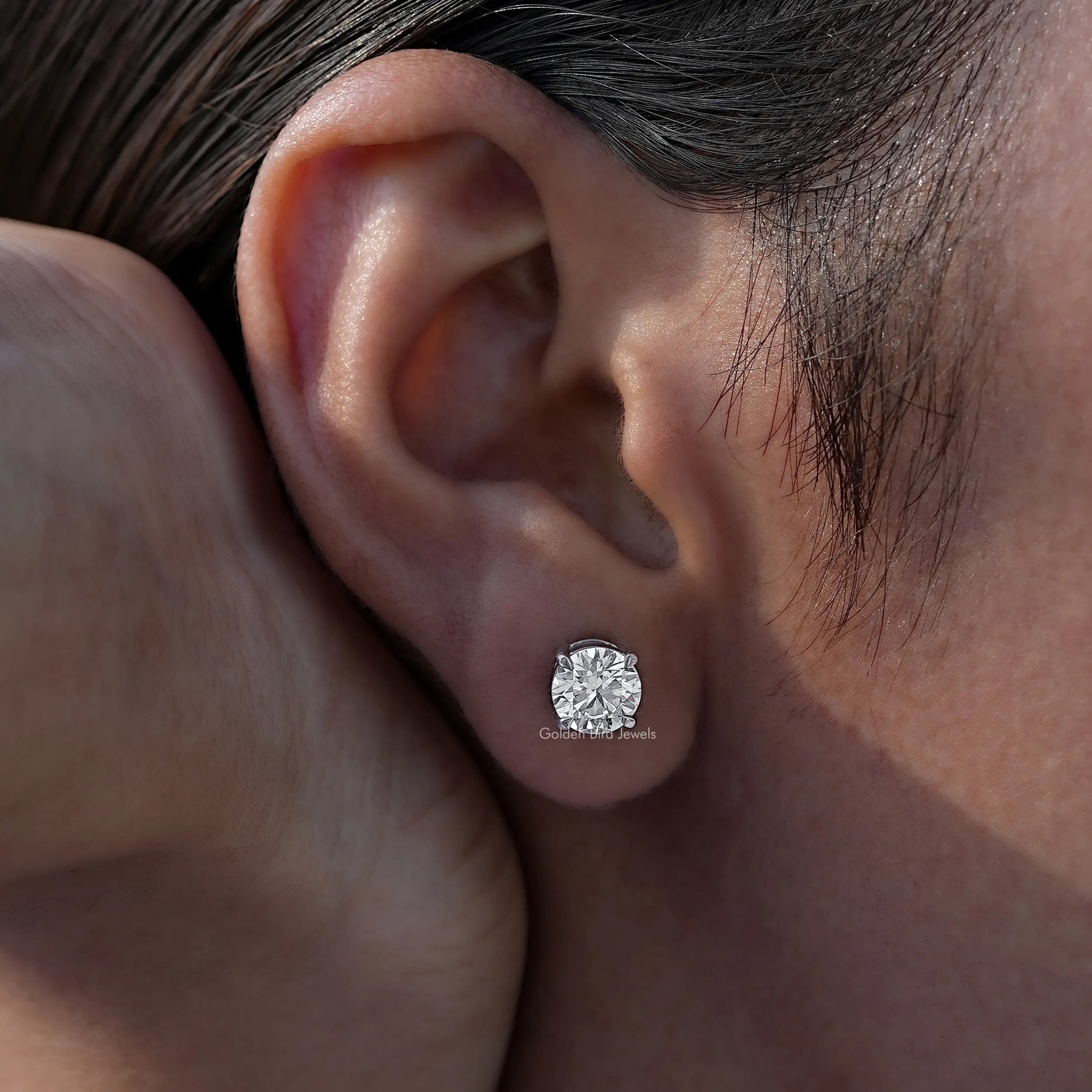 View of a Round Diamond earrings in a secure setting