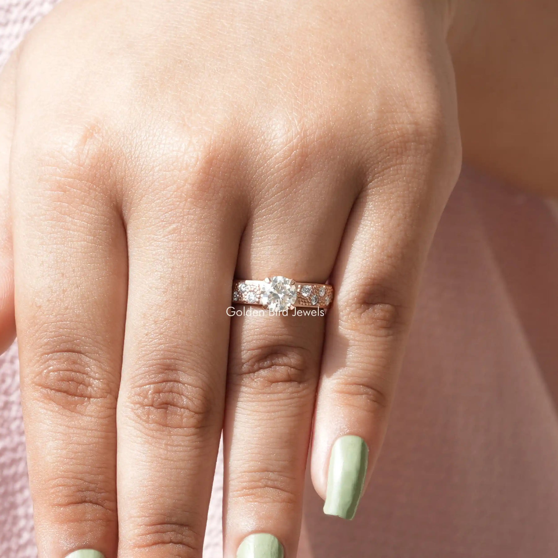 View of Round Cut Accent Stone Moissanite Ring In Yellow Gold
