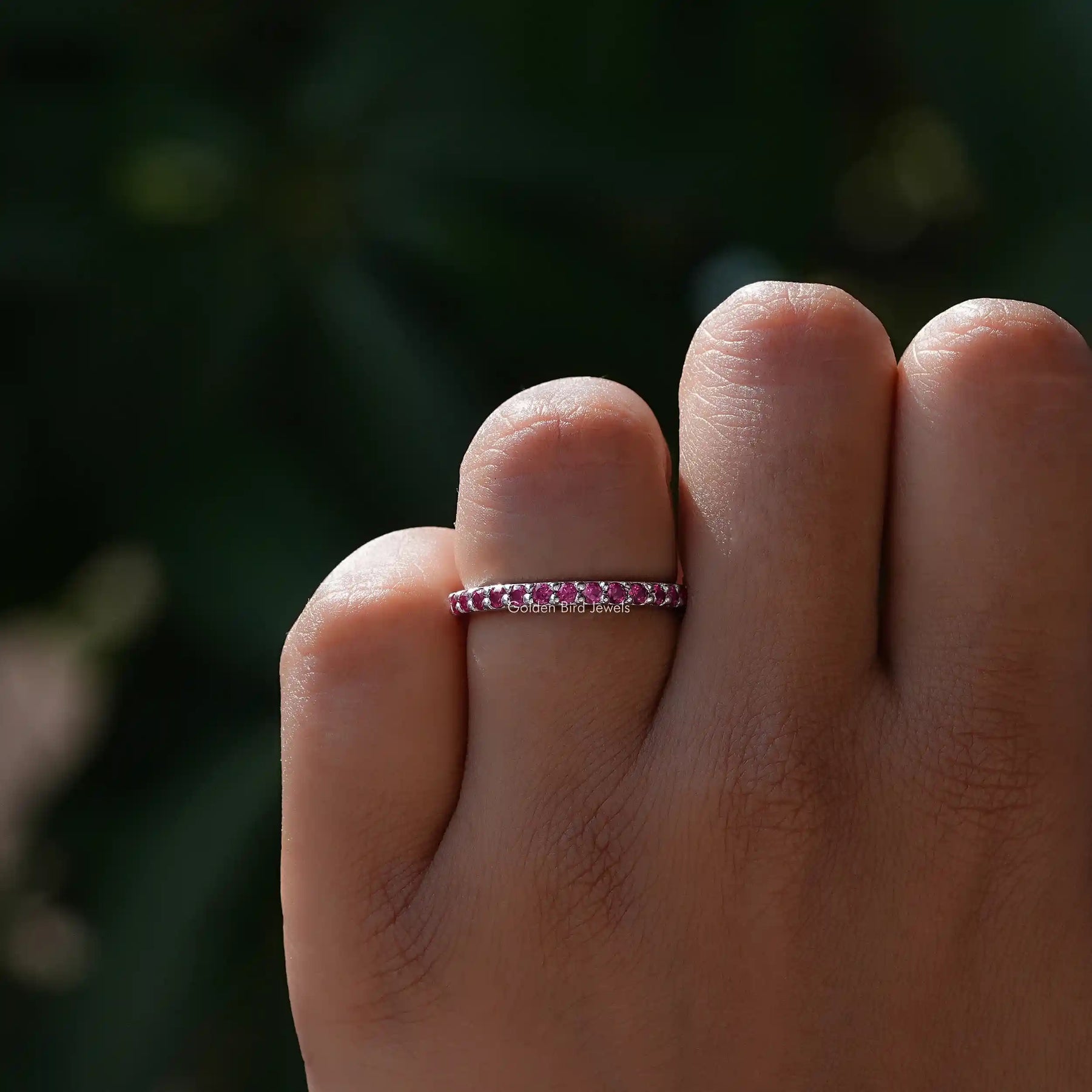 View of Pink Tourmaline Round Eternity Band in prongs setting