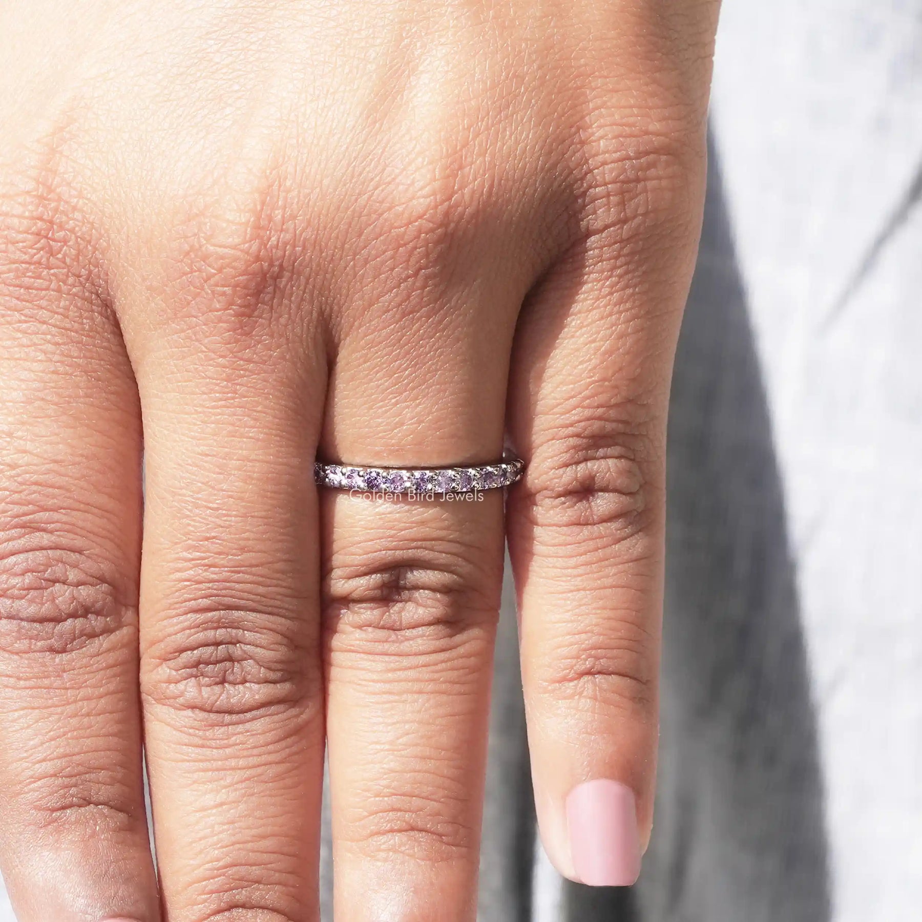 View of Blue Round Cut Moissanite Solitaire Ring in prongs setting