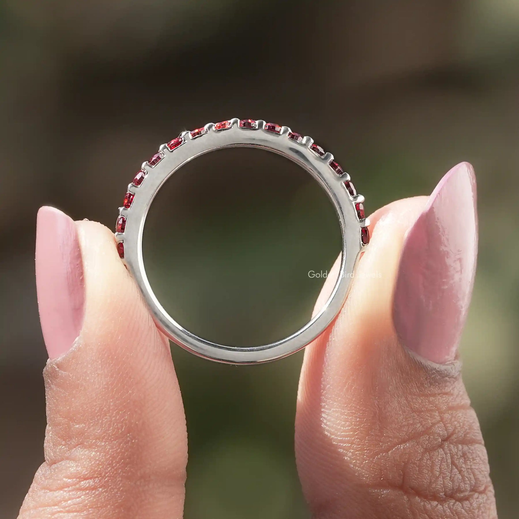 Back view of Round Cut Moissanite Eternity Band in secure setting