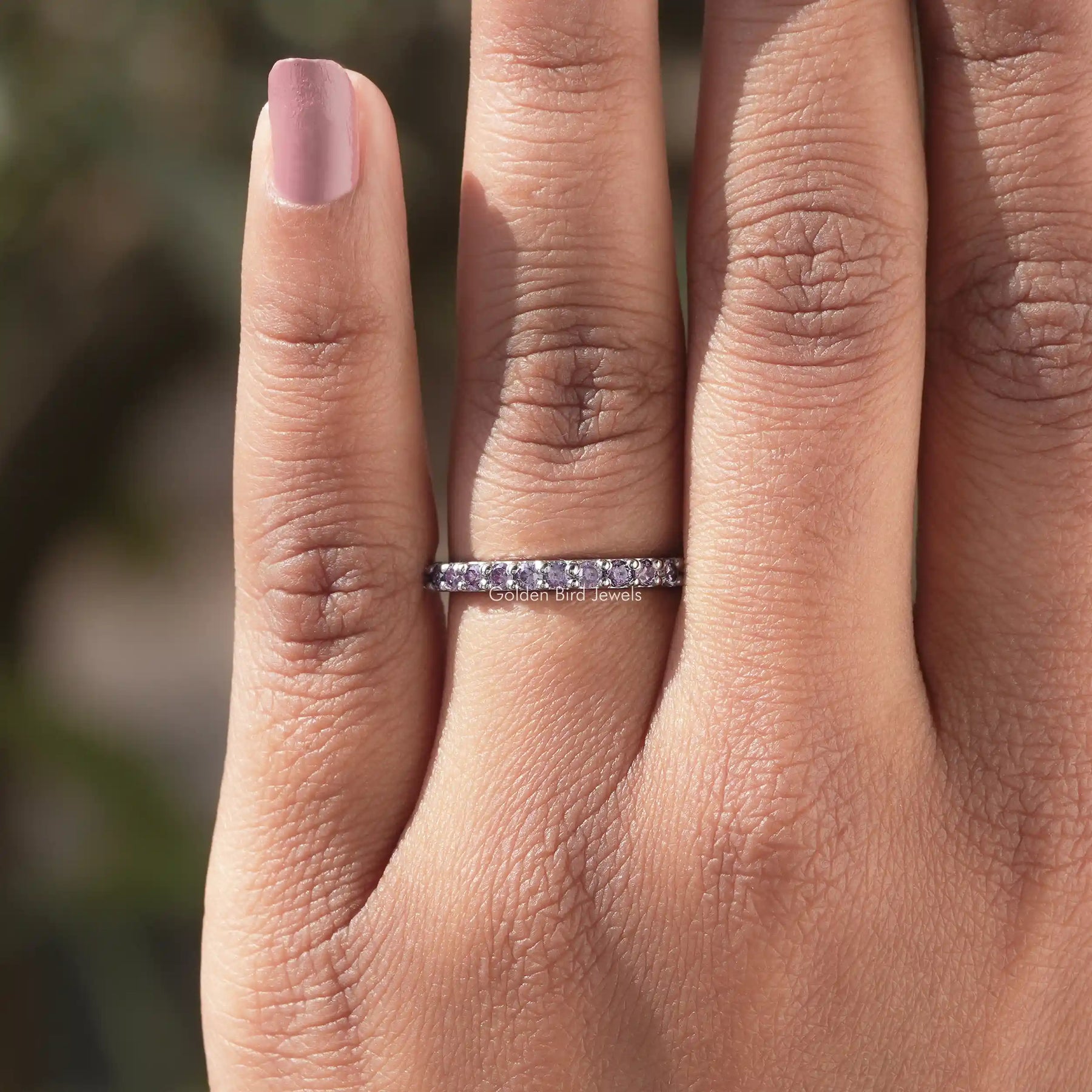 In finger view of Round Cut Moissanite Solitaire Ring