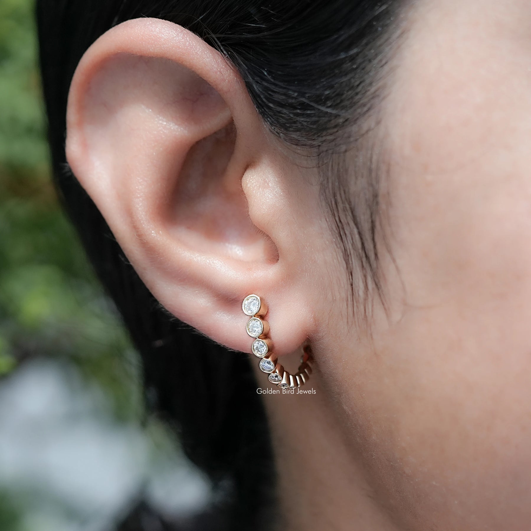 Front View Of Round Cut Moissanite Graduated C Hoop Earrings