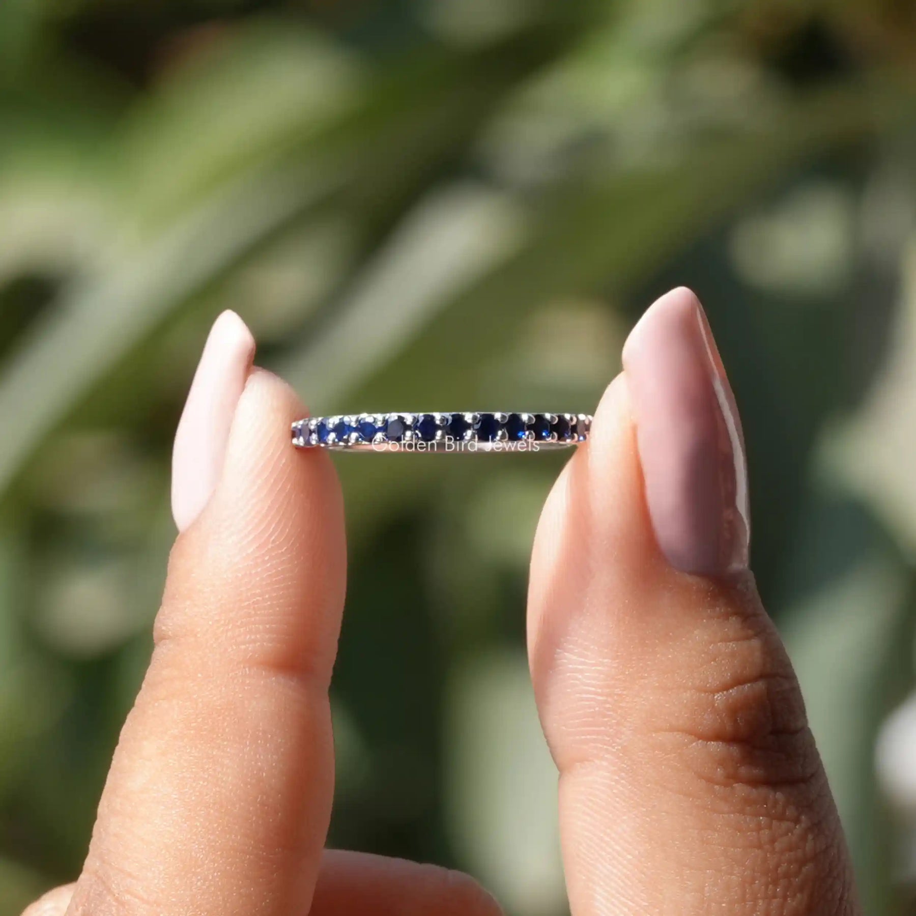 View of Round Sapphire Gemstone Eternity Band In White Gold