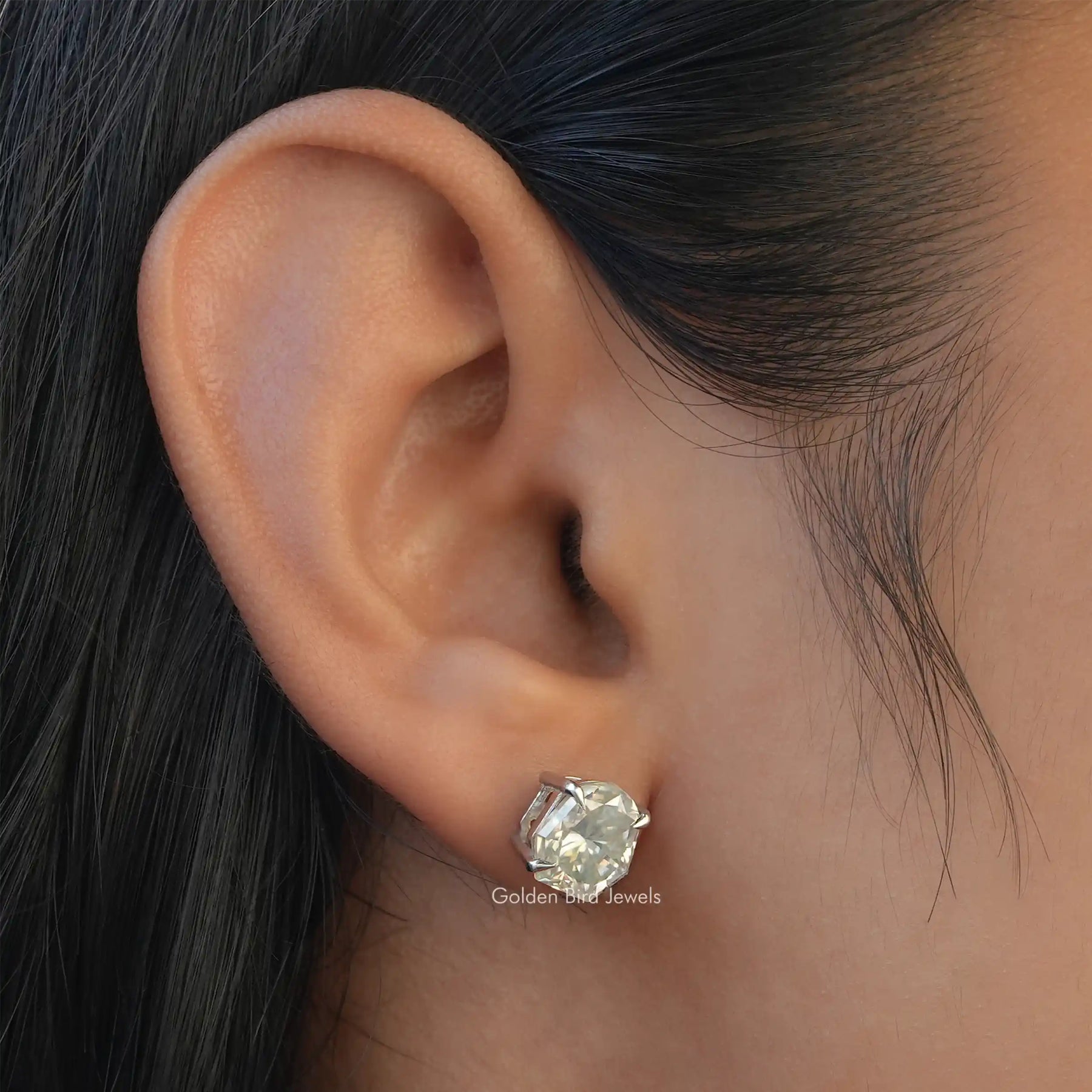 In-Ear view of shield Cut Moissanite Stud Earrings In One Photo