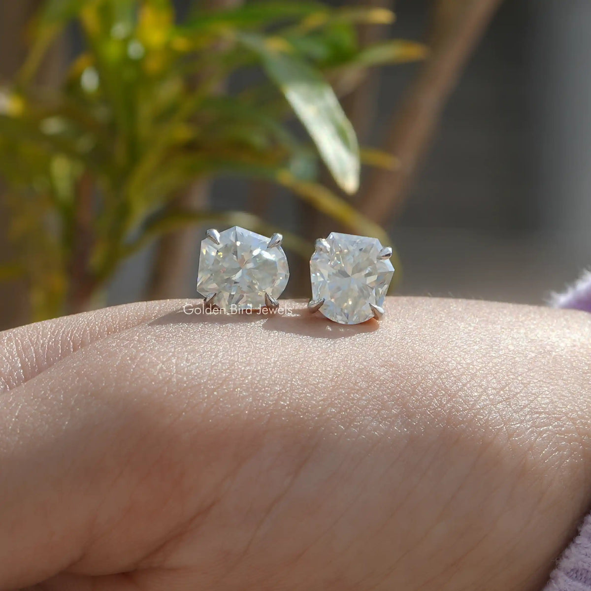 In Hand View Of shield Cut Moissanite Stud Earring