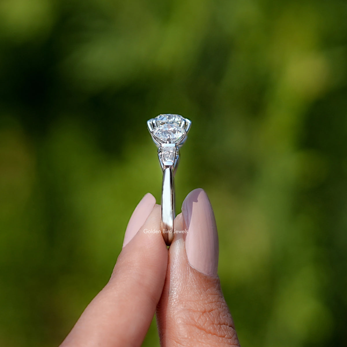 Side View of Old European Round Cut Lab Diamond Five Stone Ring In two fingers