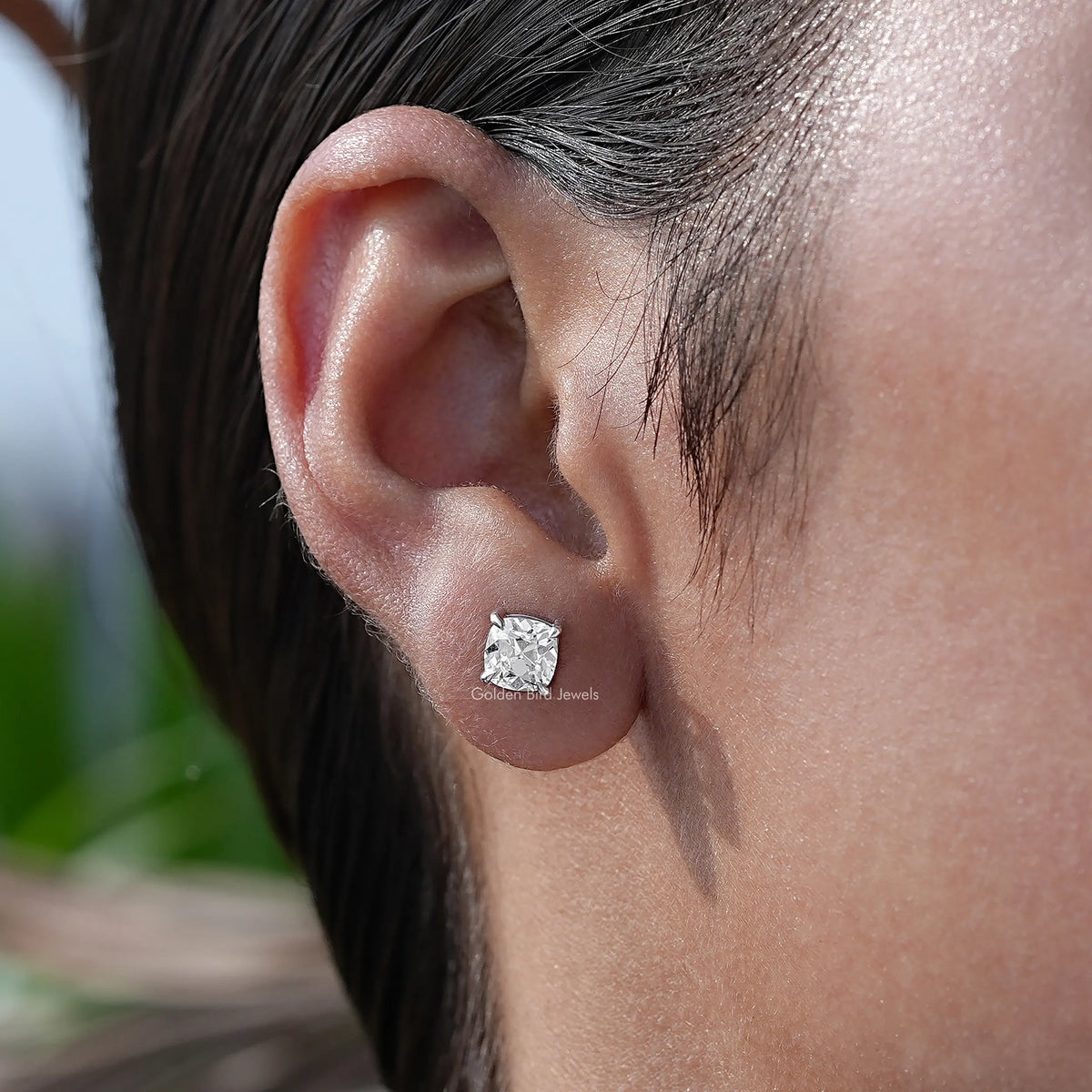 In-Ear View Of Diamond Stud Earrings in four prongs setting