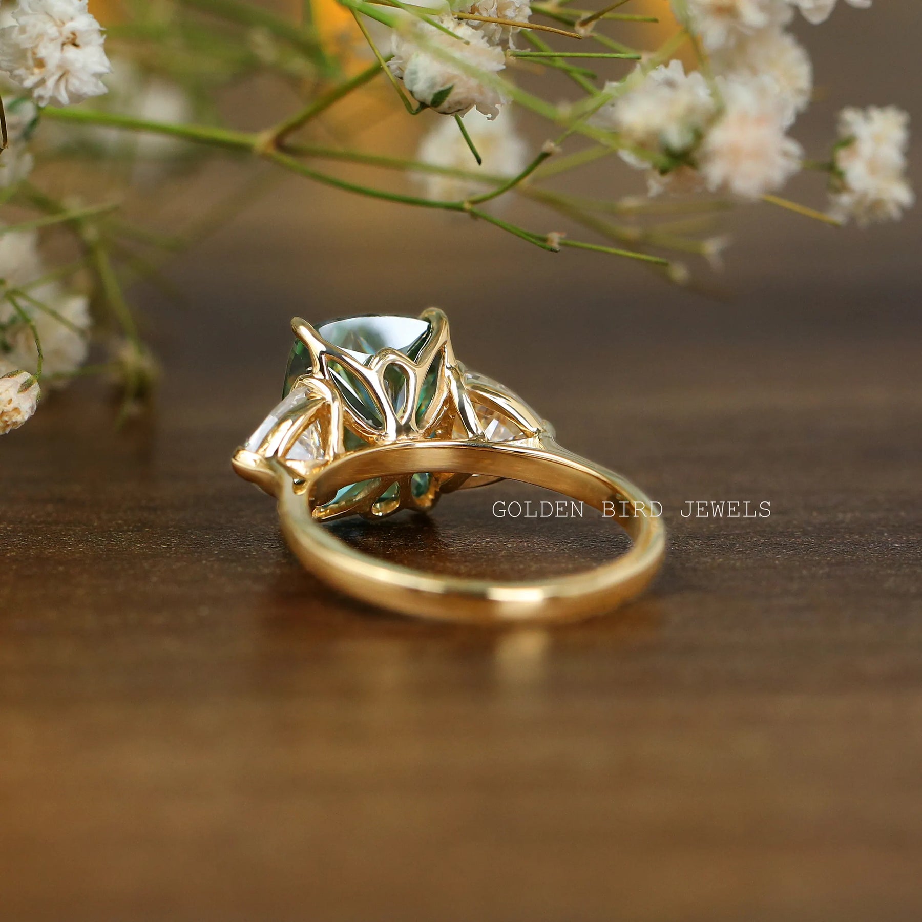 Detailed back view of trillion cut three stone engagement ring