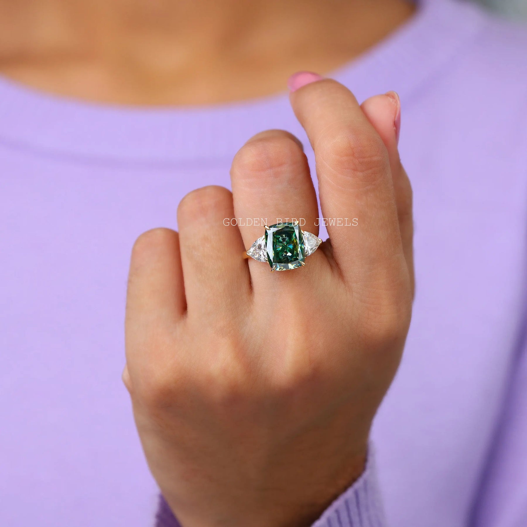 In Finger view of three stone moissanite ring