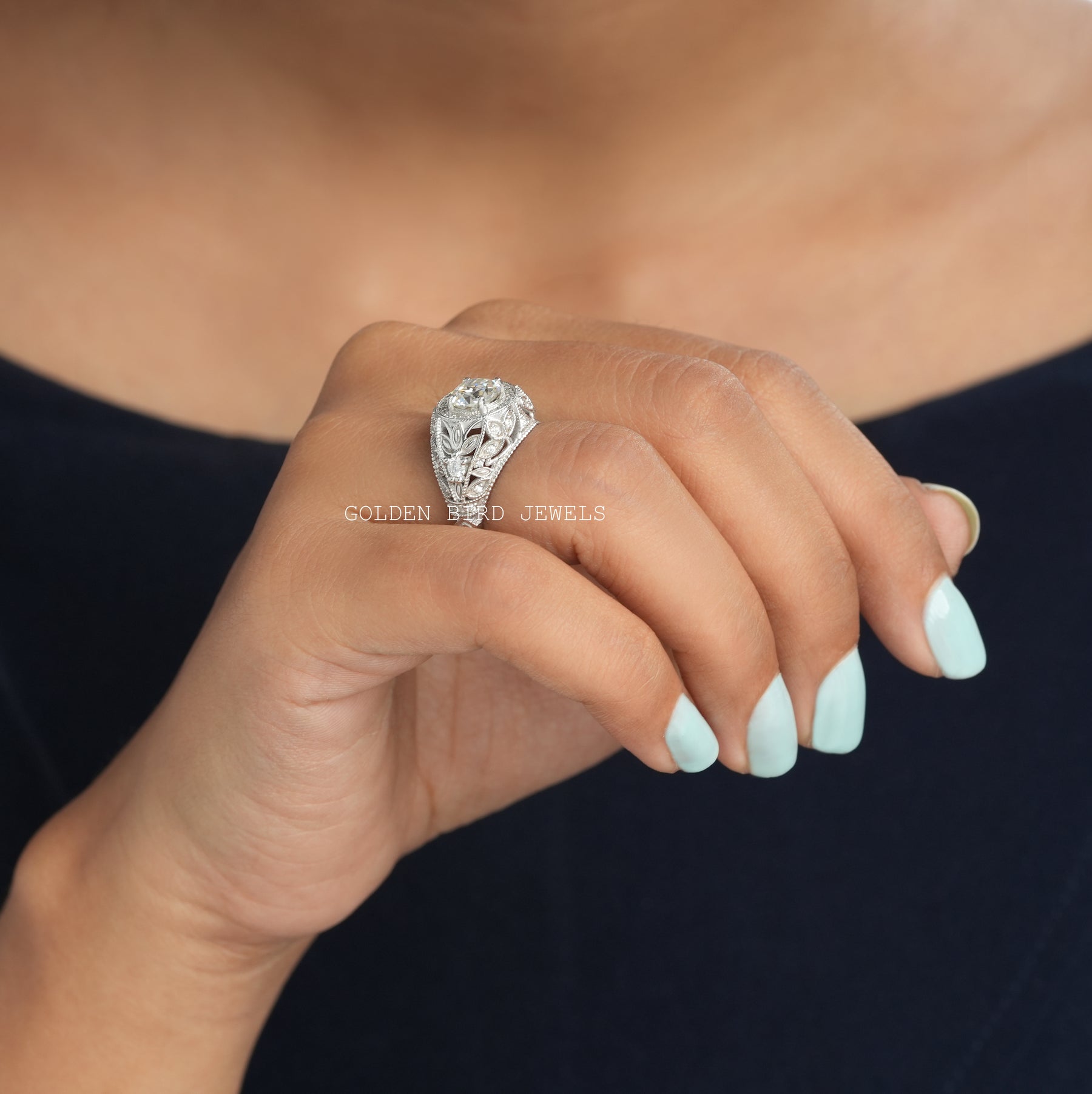 In Finger Side View Of OEC Round Moissanite Engagement Ring