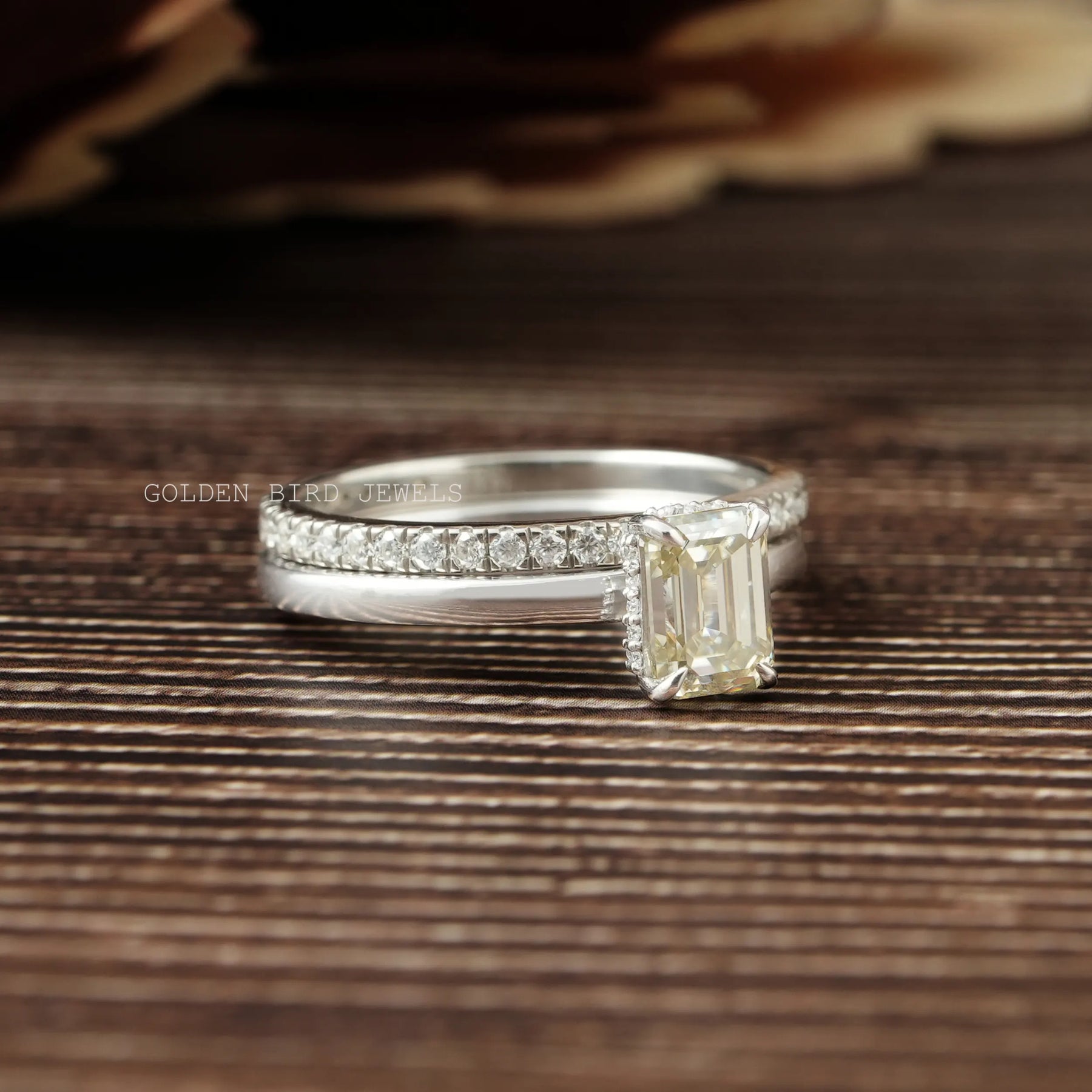 Detailed View of Emerald Cut Hidden Halo Wedding Band In White Gold