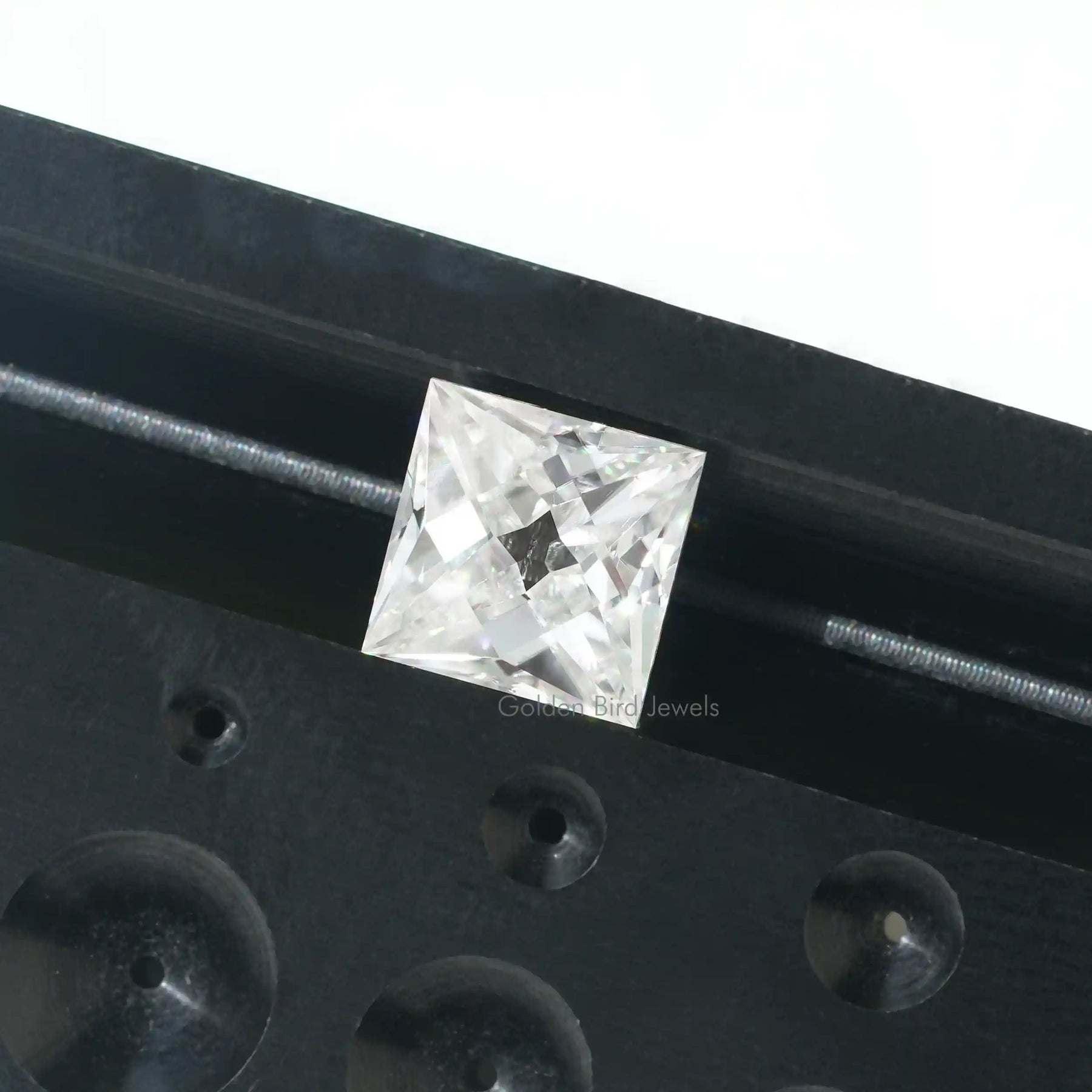 Close view of Old Mine Emerald Cut Loose Moissanite