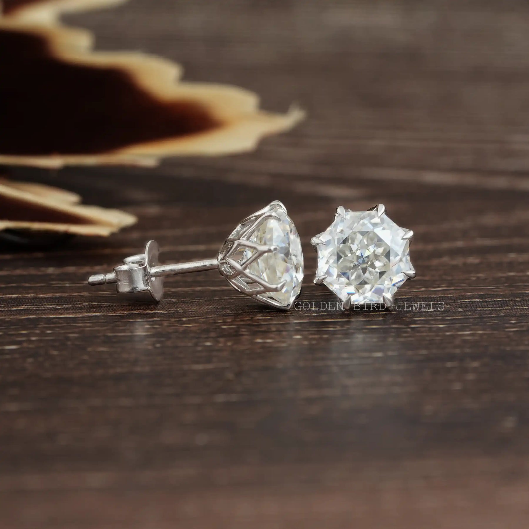Front And Back Side View Of solitaire stud earrings crafted in moissanite