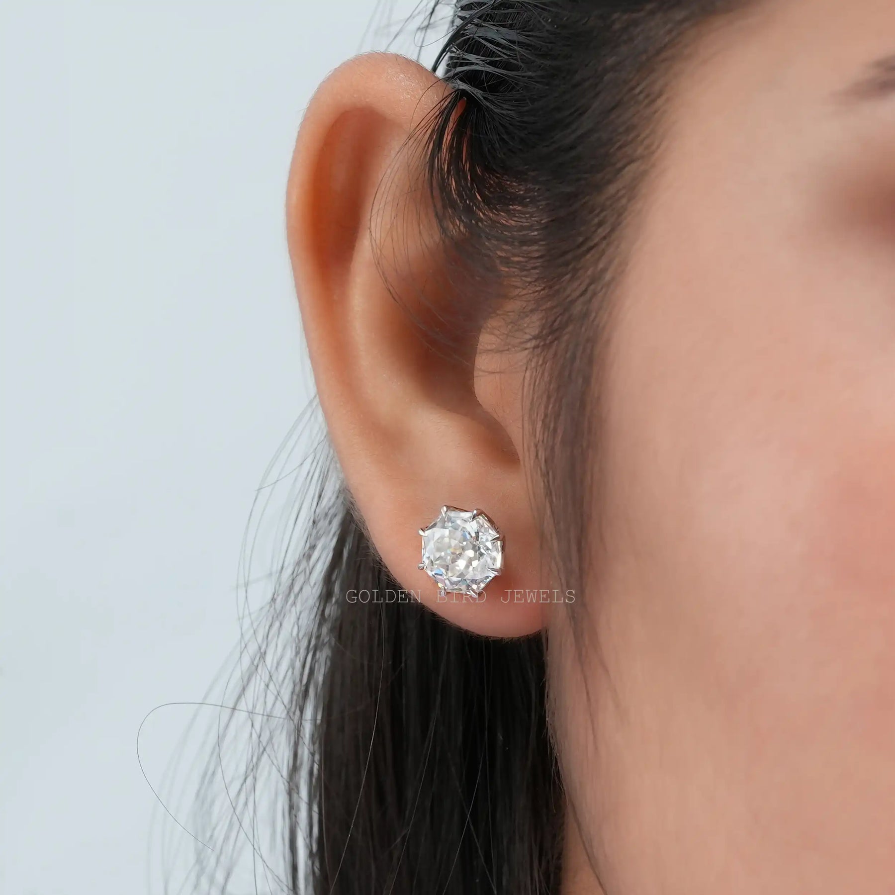 In ear view of octagon cut cluster moissanite earrings