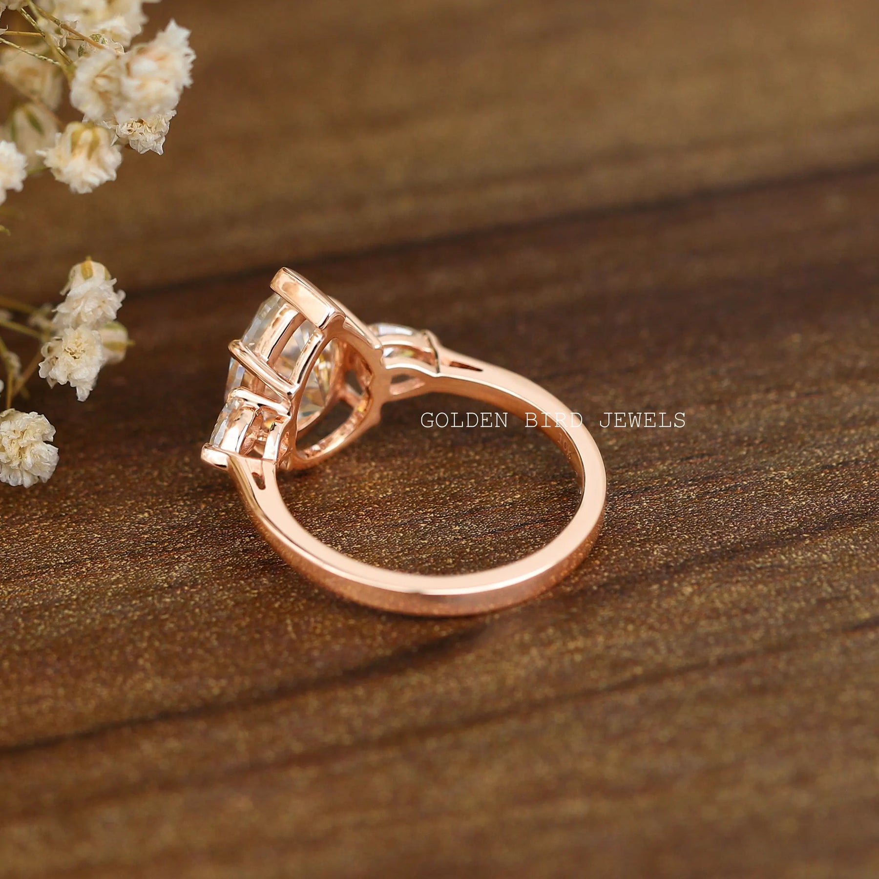Back view of  three-stone engagement ring  crafted in unique secure design