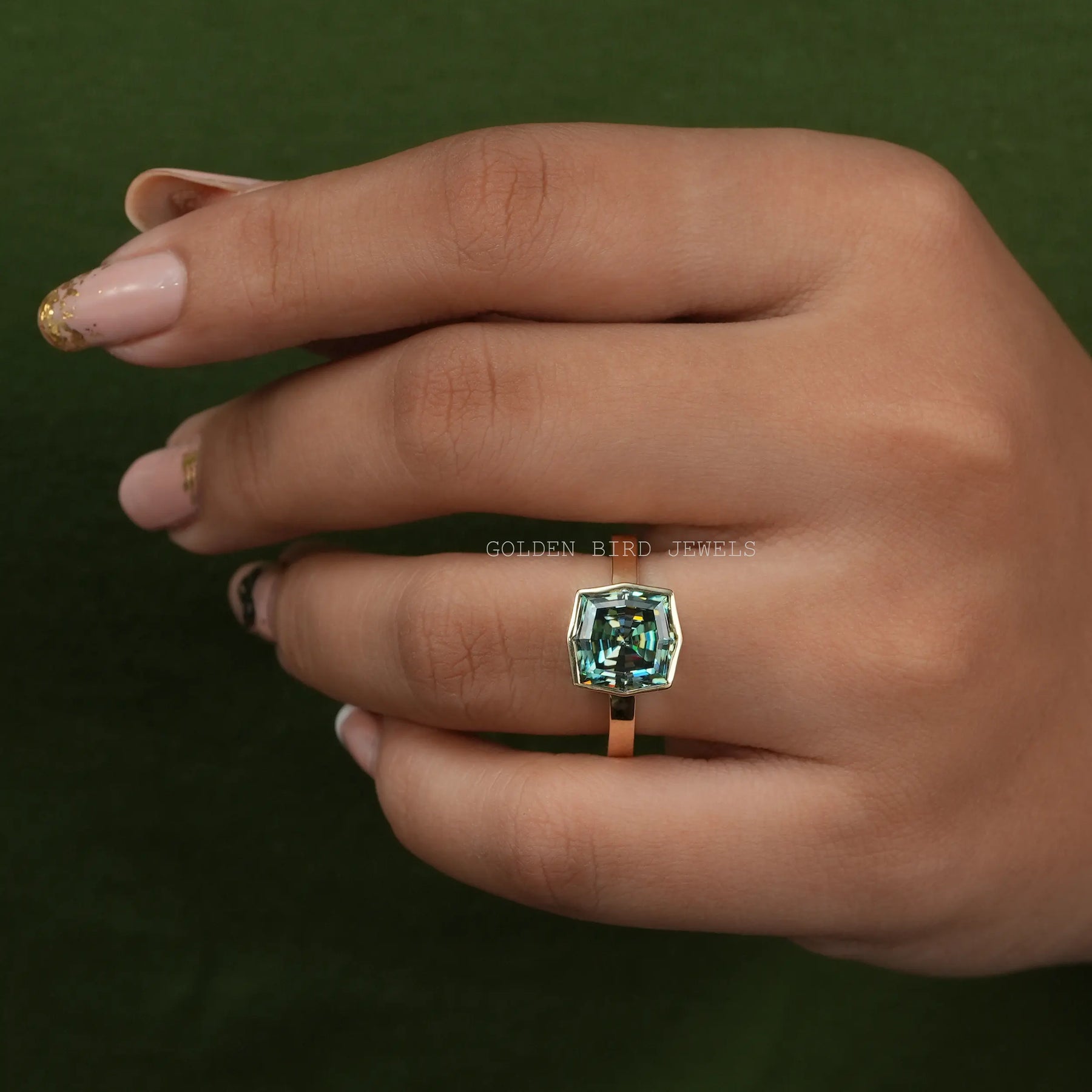 In Finger View Of Blue Green Step Cut Cushion Bezel Set Solitaire Engagement Ring