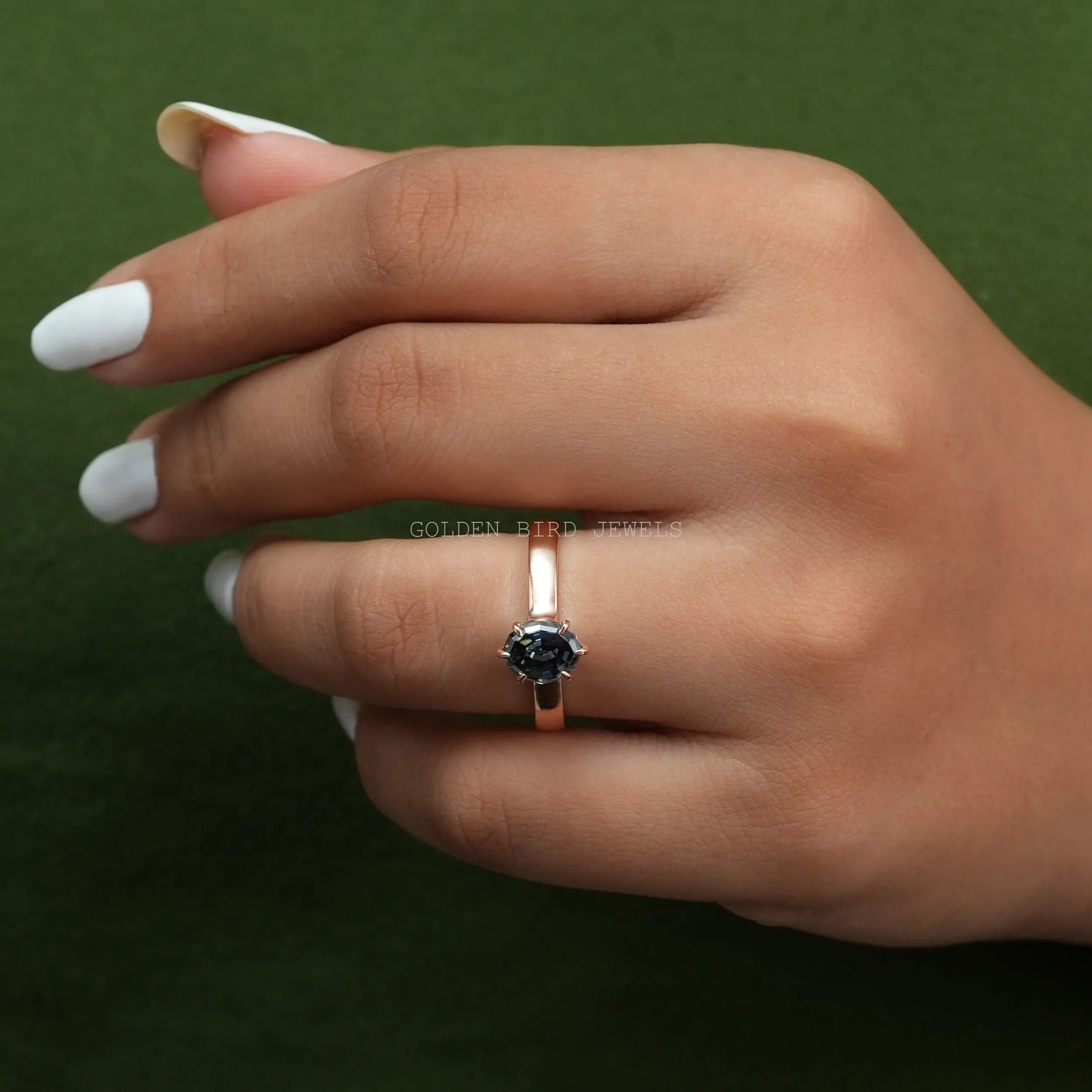 In Hand View Of 1.70 Carat Gray Color Step Cut Oval Shape Moissanite Engagement Ring