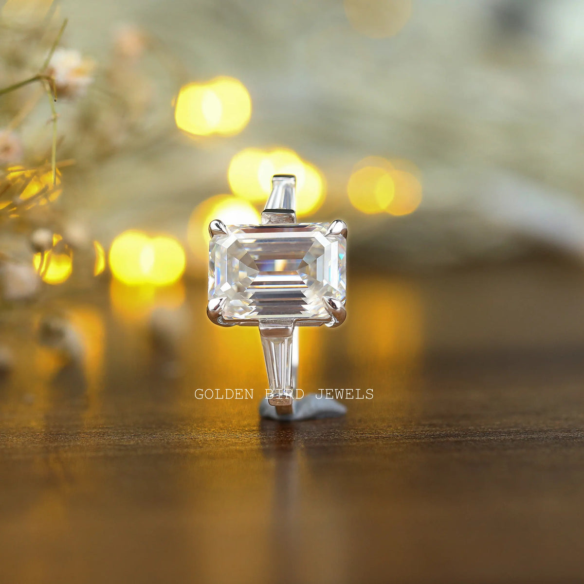 Detailed View Of Three Stone Emerald Cut Moissanite Ring In White Gold