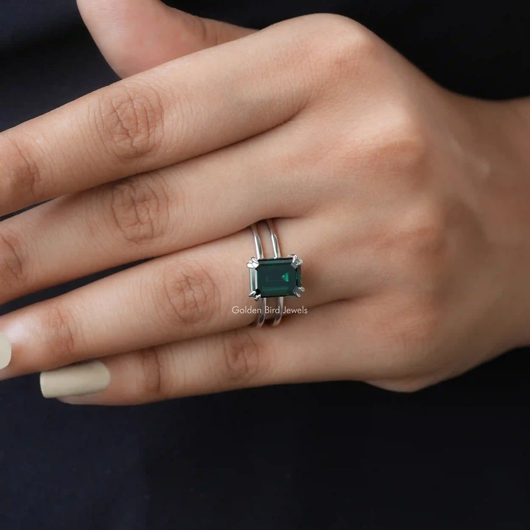[In Finger Front View Of Solitaire Emerald Cut Moissanite Engagement Ring]-[Golden Bird Jewels]