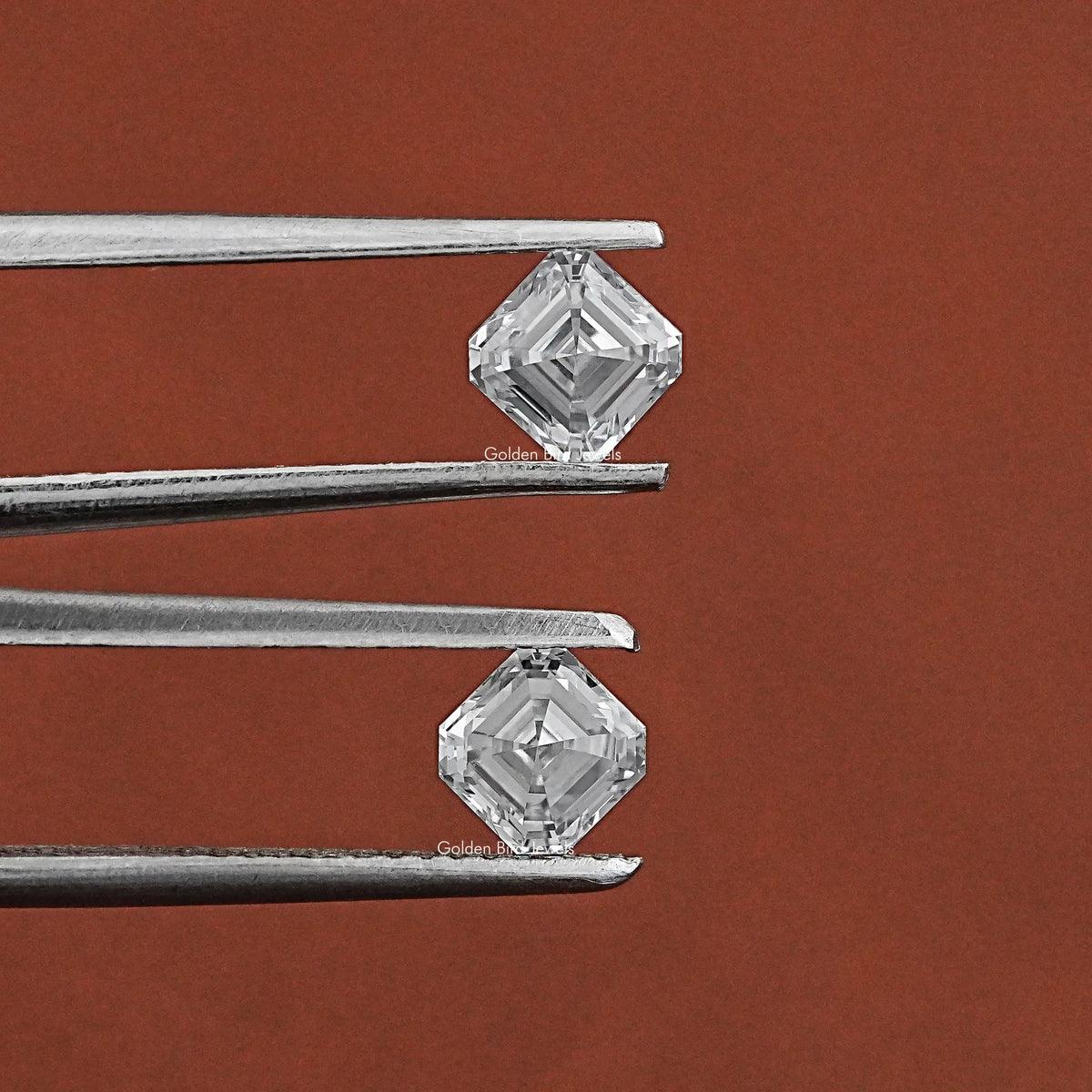 Tweezer holding the Asscher Cut Lab Grown Diamond Pair